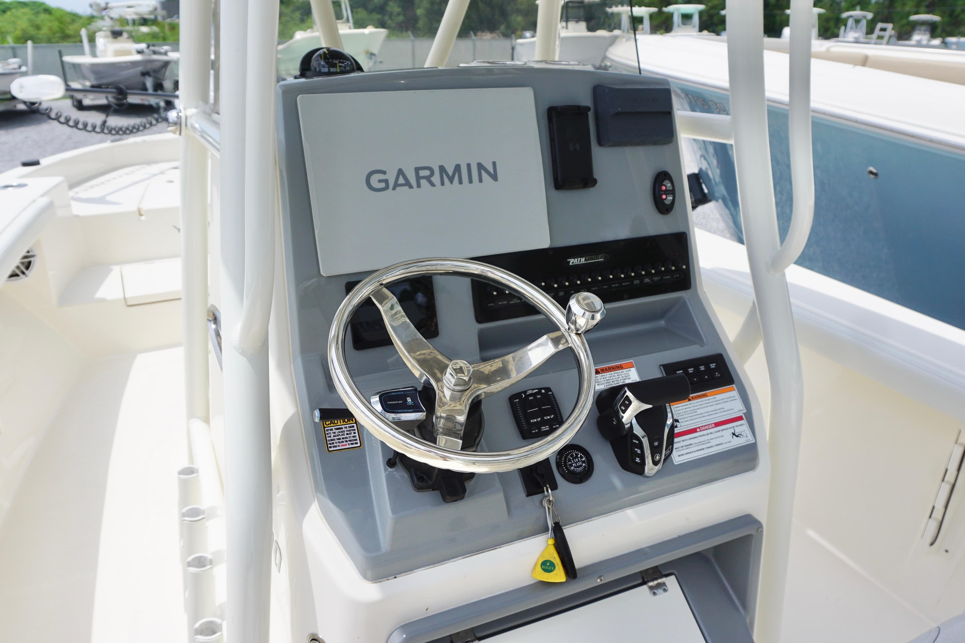 2024 Pathfinder 2700 Open boat console with Garmin navigation system and steering wheel.