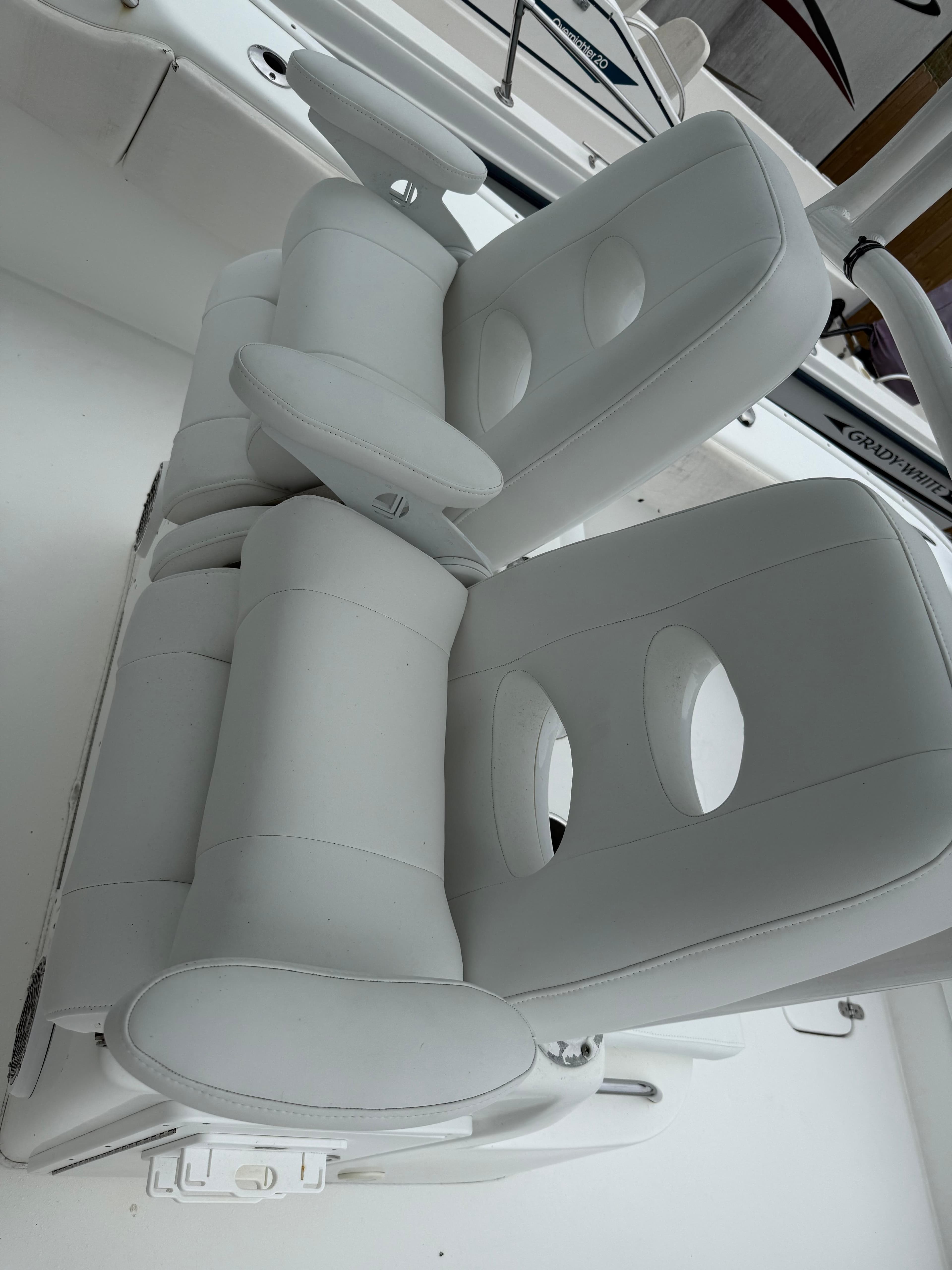 2019 Cape Horn 31 boat with white cushioned seats and armrests.