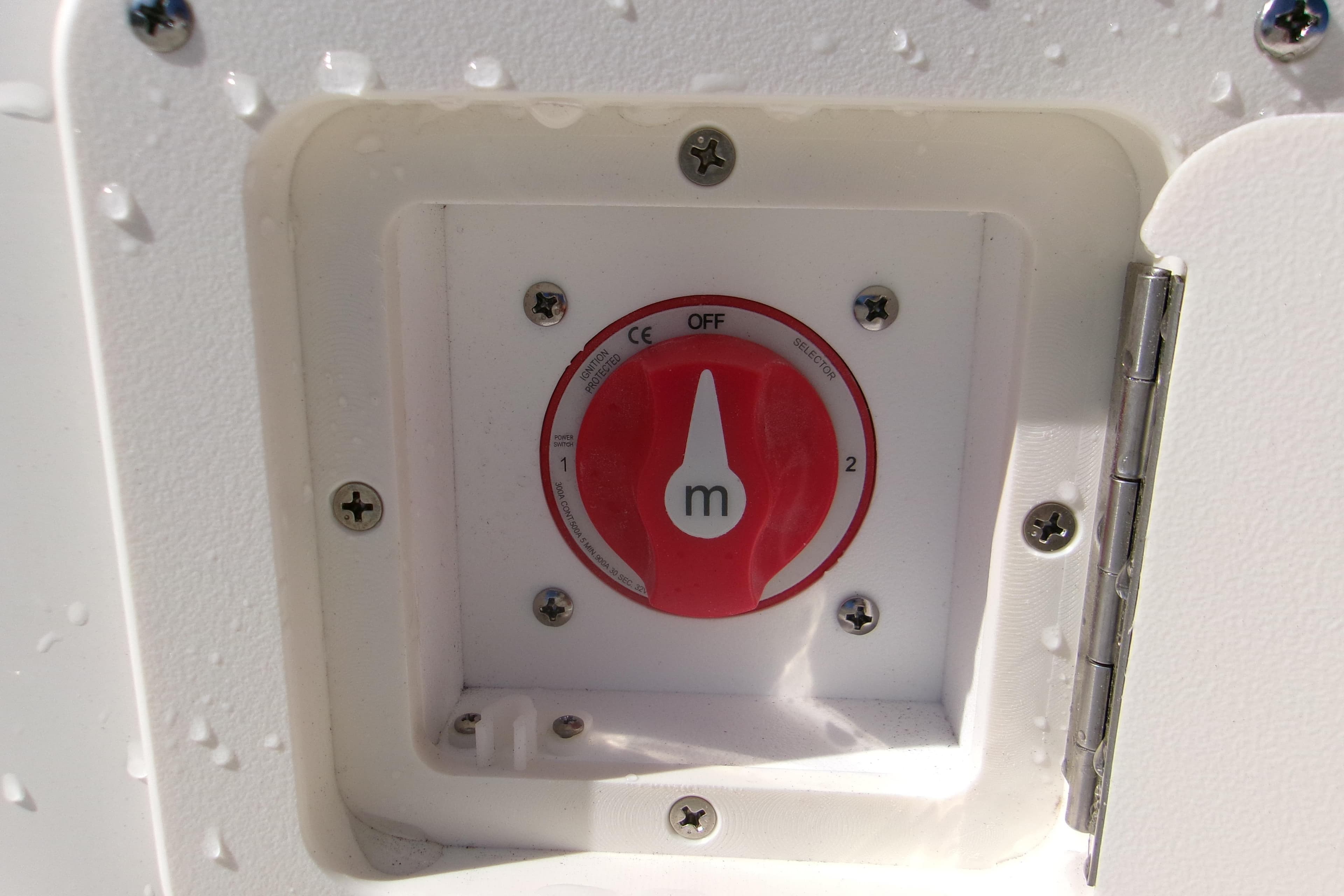 Battery switch on 2026 Key West 1720 Center Console boat, with water droplets.