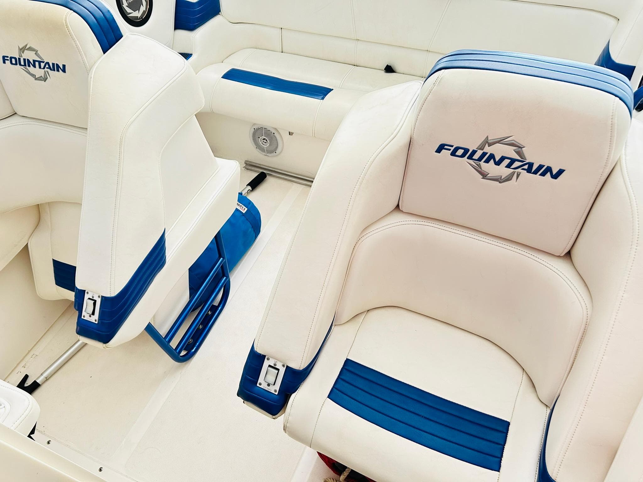 2005 Fountain 42 Executioner boat interior with white and blue seating.
