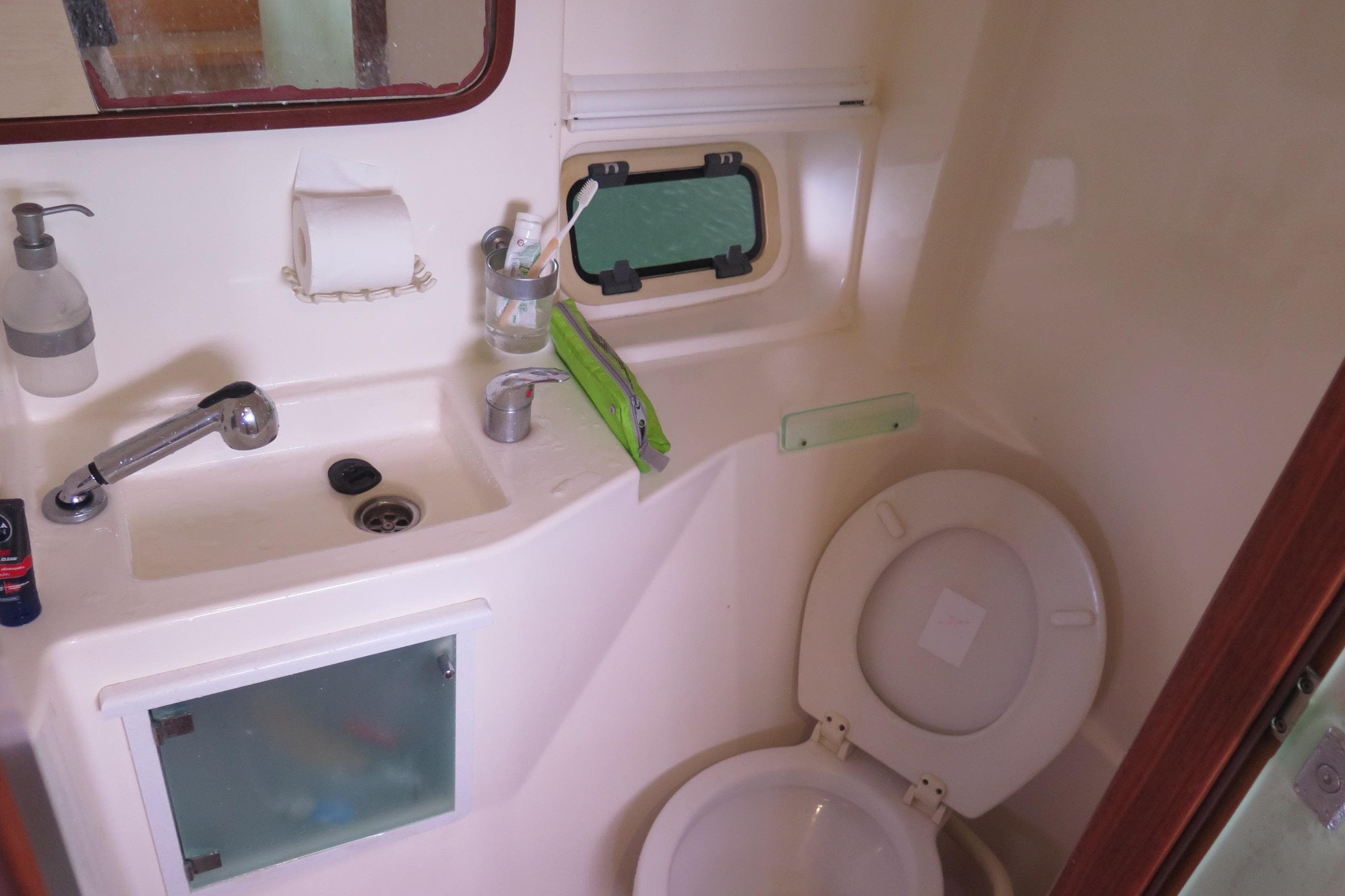 Bathroom interior of 2011 Catana 47 yacht with sink and toilet.