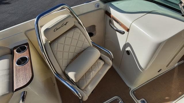 Luxurious seating in 2017 Chris-Craft Launch 27 boat with elegant design and cup holders.