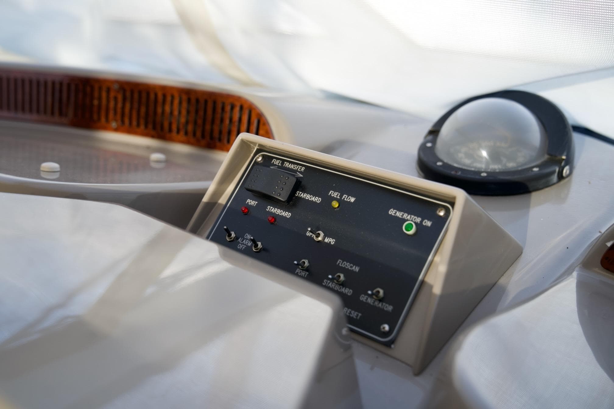 Control panel on 2000 Carver 506 Motor Yacht, featuring fuel transfer and generator indicators.