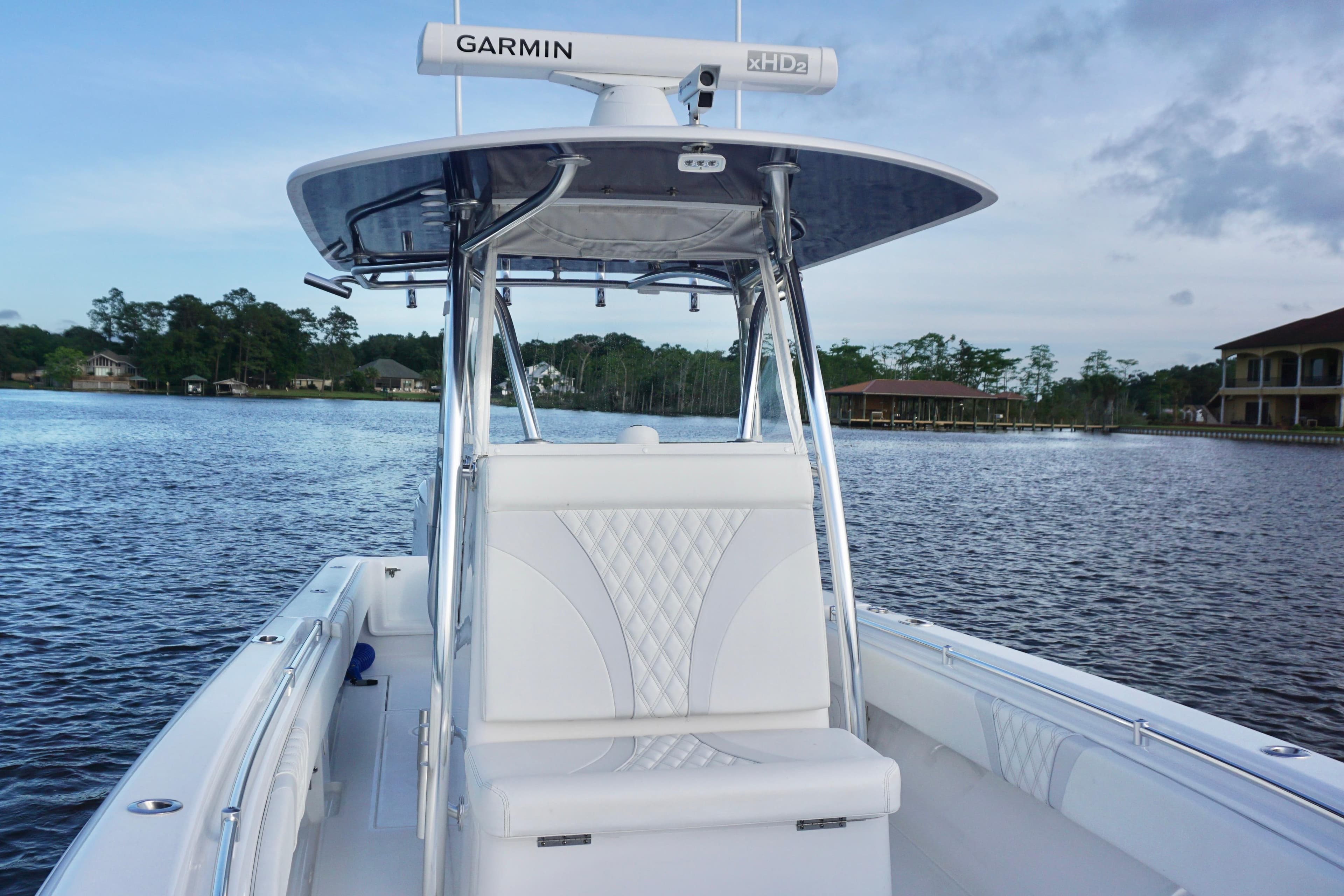 2022 Contender 28 Tournament boat on calm water, featuring Garmin radar and sleek design.