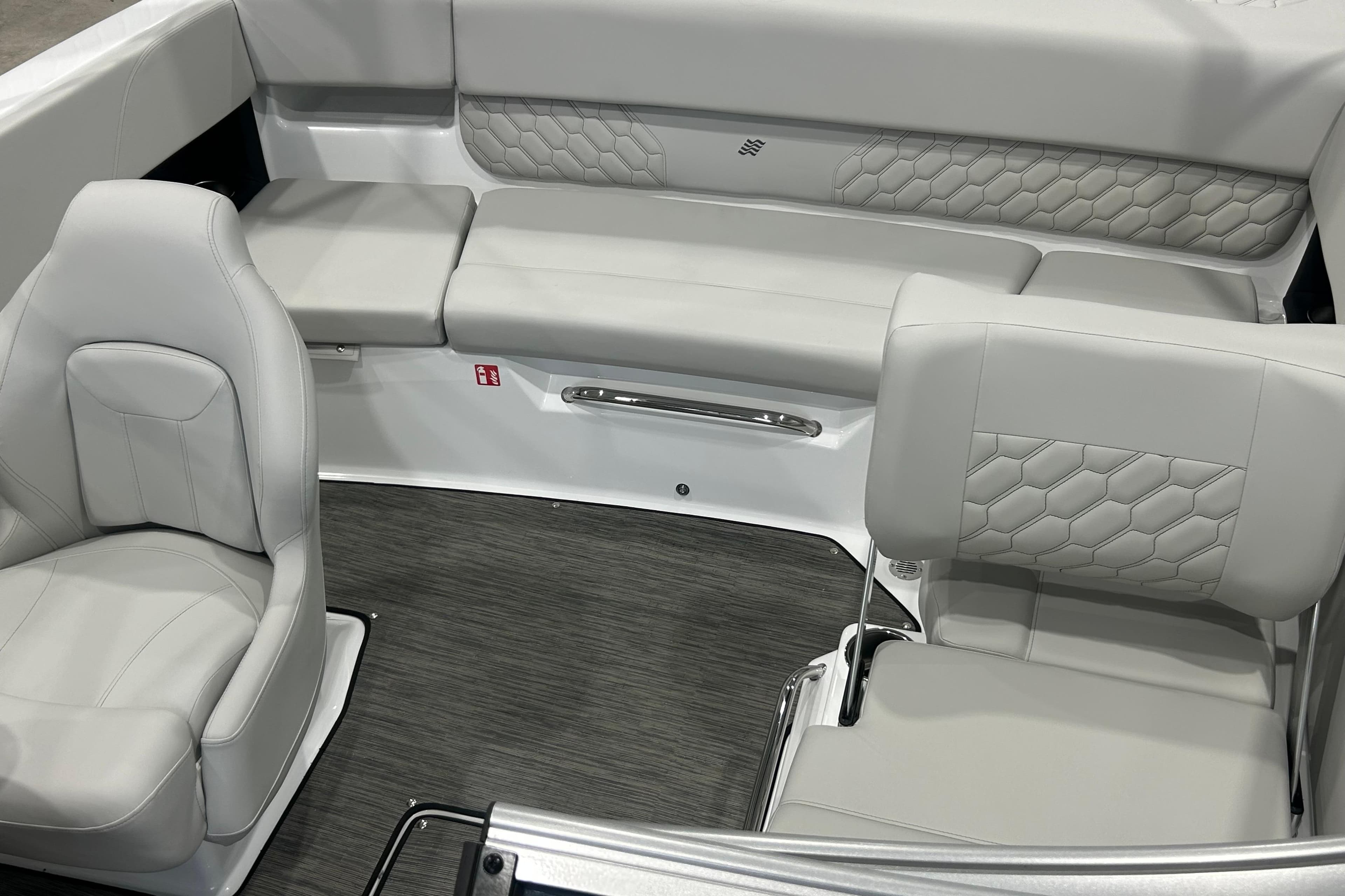 2026 Four Winns H1 Freedom boat interior with luxurious gray seating and modern design.