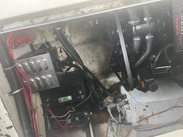 Engine compartment of a 1997 Monterey 296 Cruiser boat, showing wiring and mechanical components.
