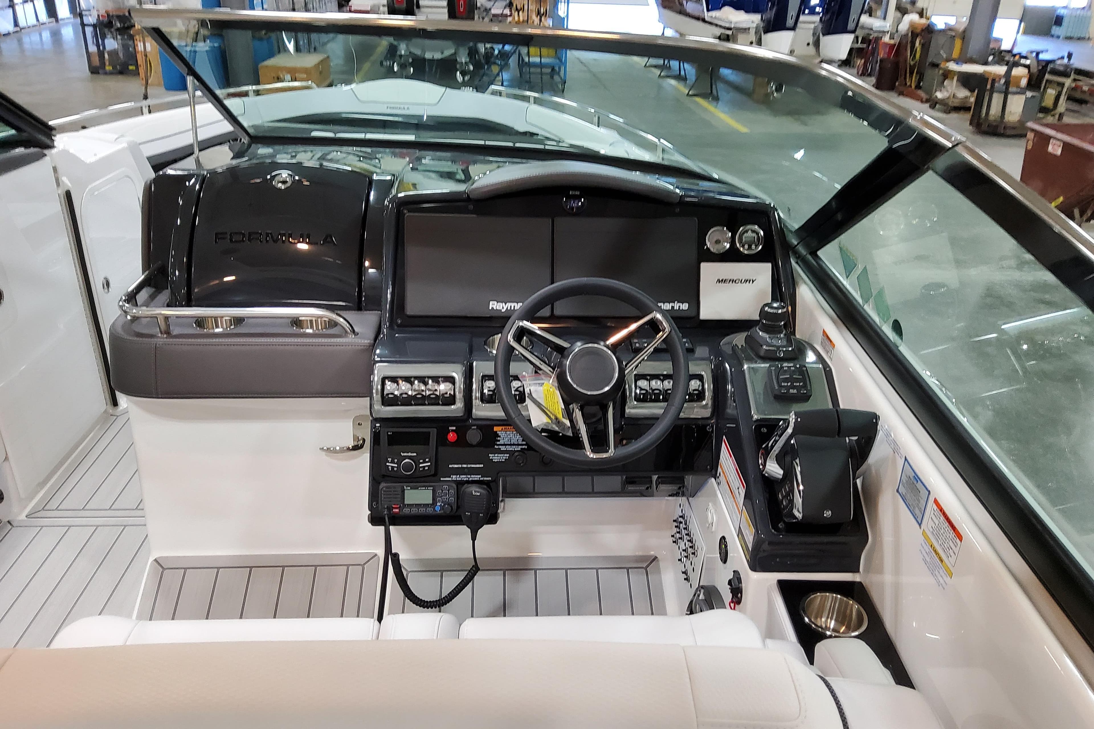2026 Formula 350 Crossover Bowrider OB cockpit with modern controls and navigation systems.