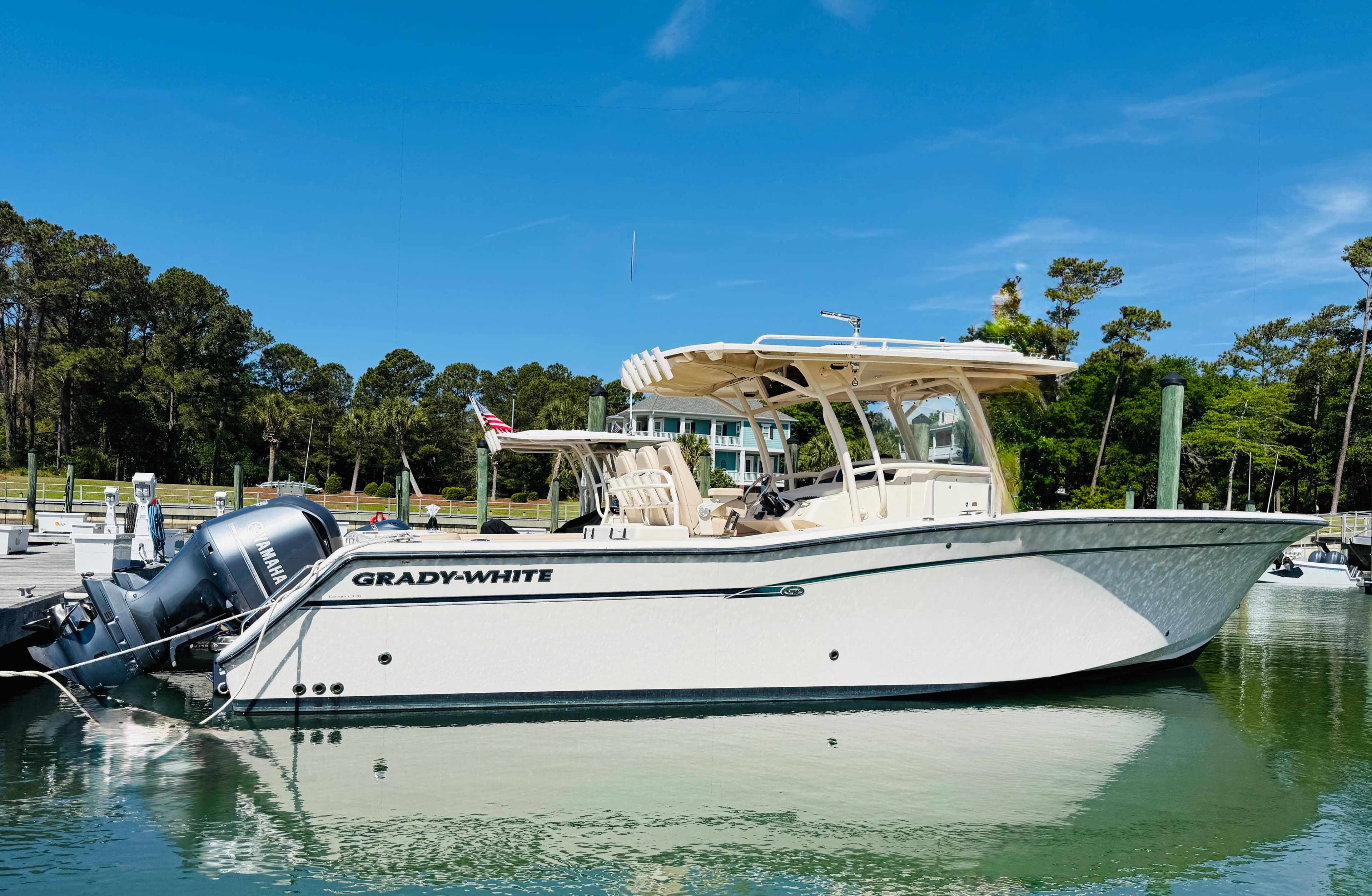 2015 Grady-White 336 Canyon boat docked in a scenic marina setting.