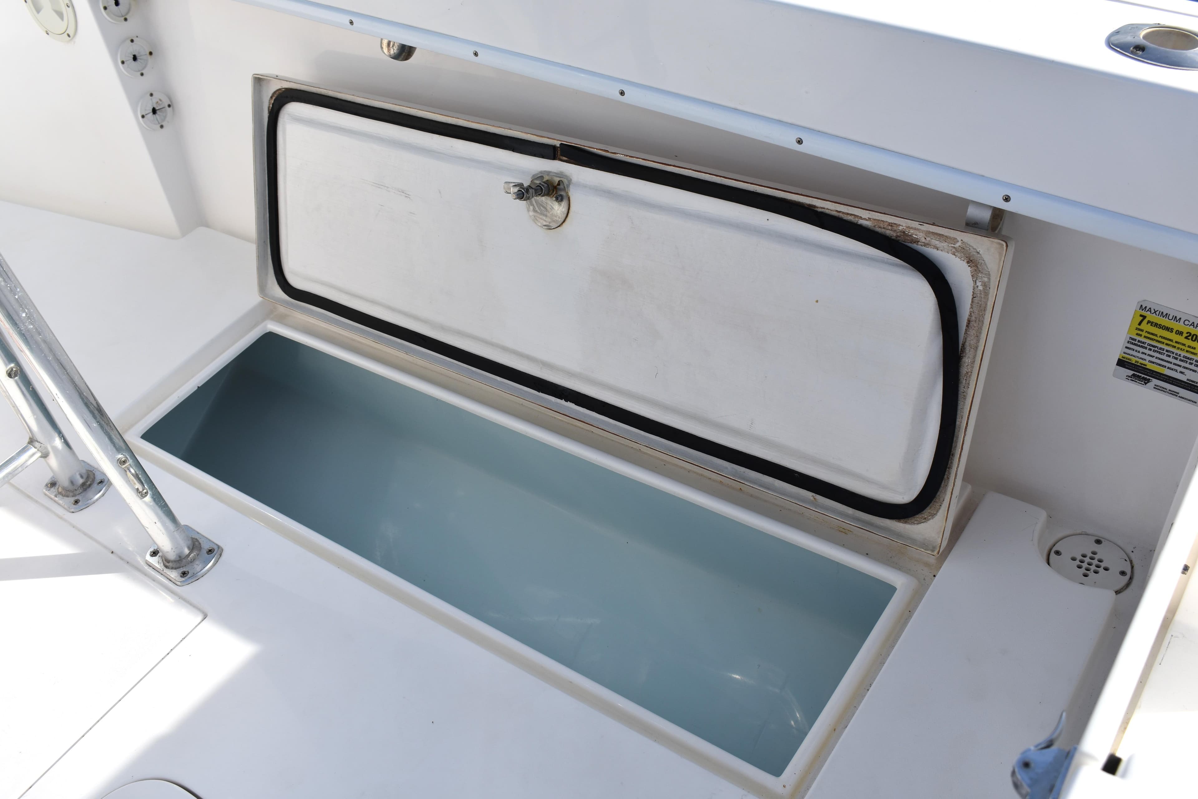 Open storage compartment on a 2014 Contender 23 Open boat.