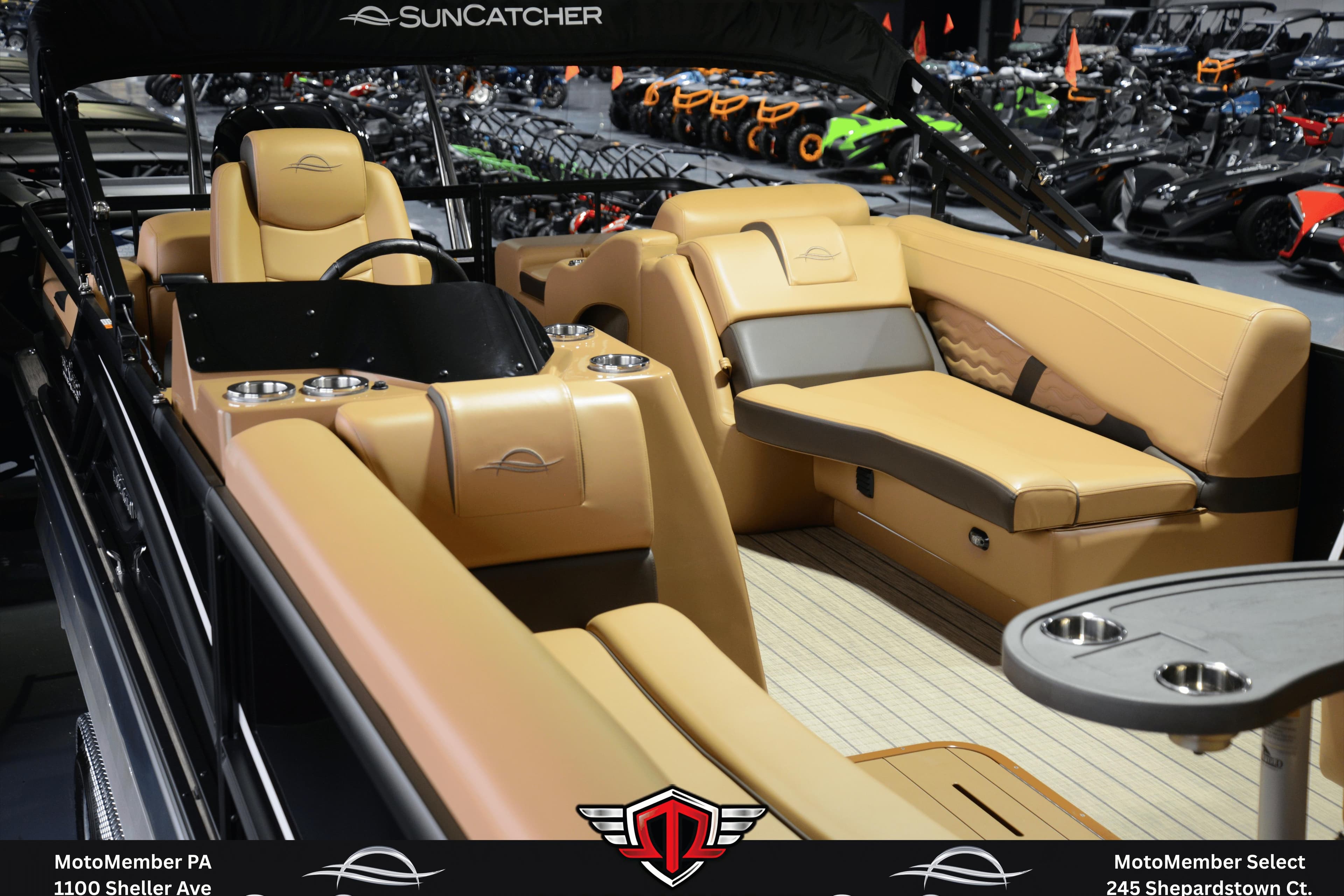 Luxurious interior of 2025 SunCatcher Fusion 324SS pontoon boat with tan seating.