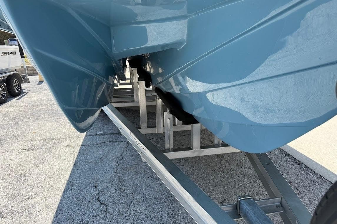 2026 Shallow Sport 25 X3 boat hull on trailer, showcasing sleek design.