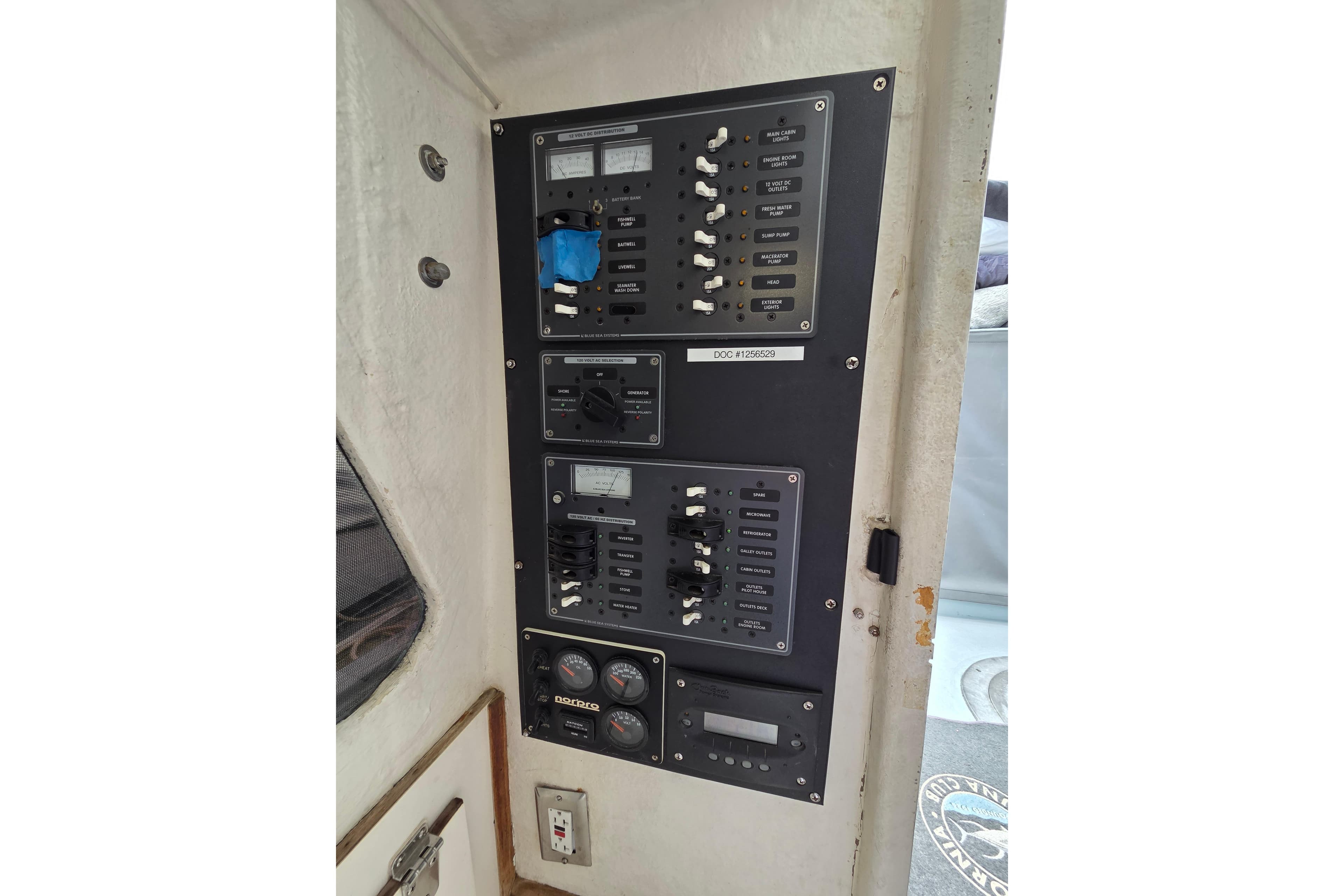 Electrical control panel on a 1995 Custom 32 Branko Enclosed Bridge boat.