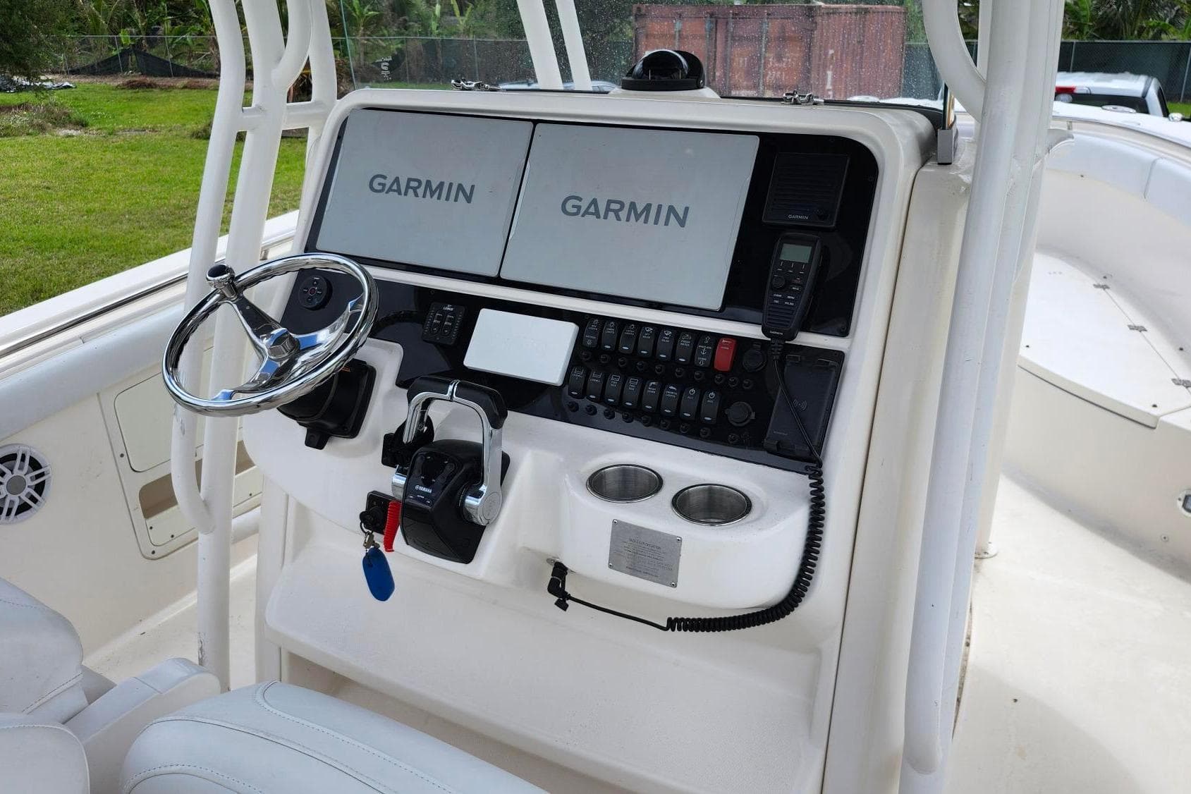2015 Robalo R300 Center Console helm with Garmin displays and controls.