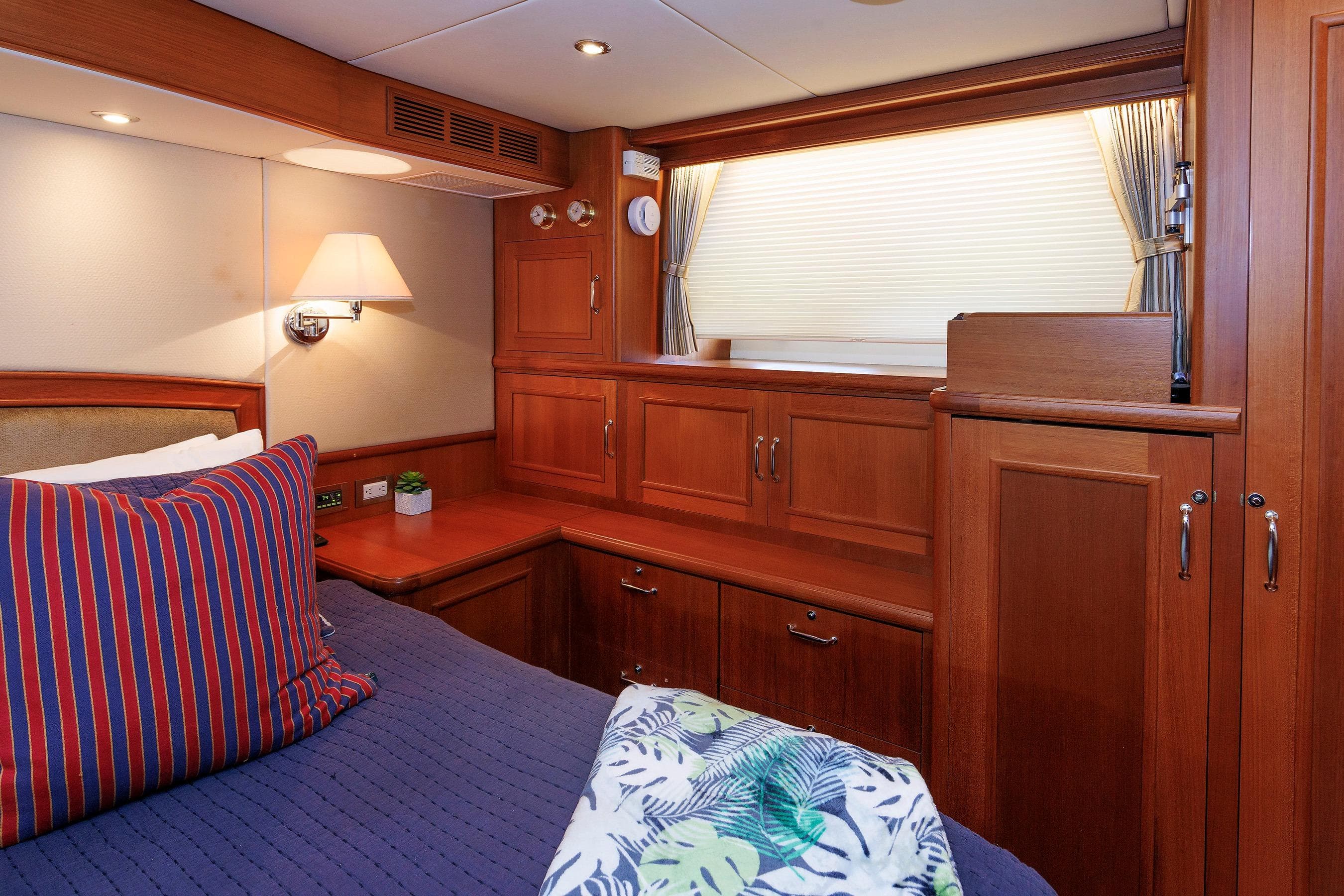 Luxurious cabin interior of 2007 Grand Banks 59 Aleutian RP yacht with wooden cabinetry.