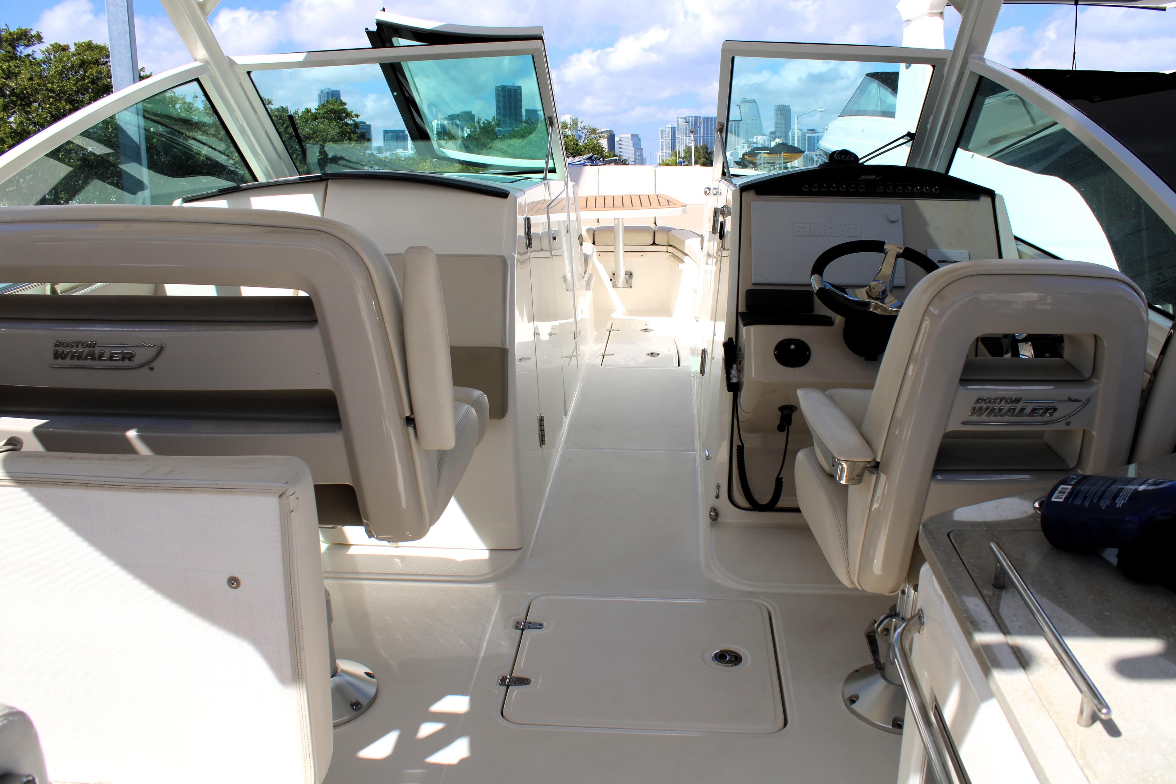 2021 Boston Whaler 320 Vantage boat interior with helm and seating area.