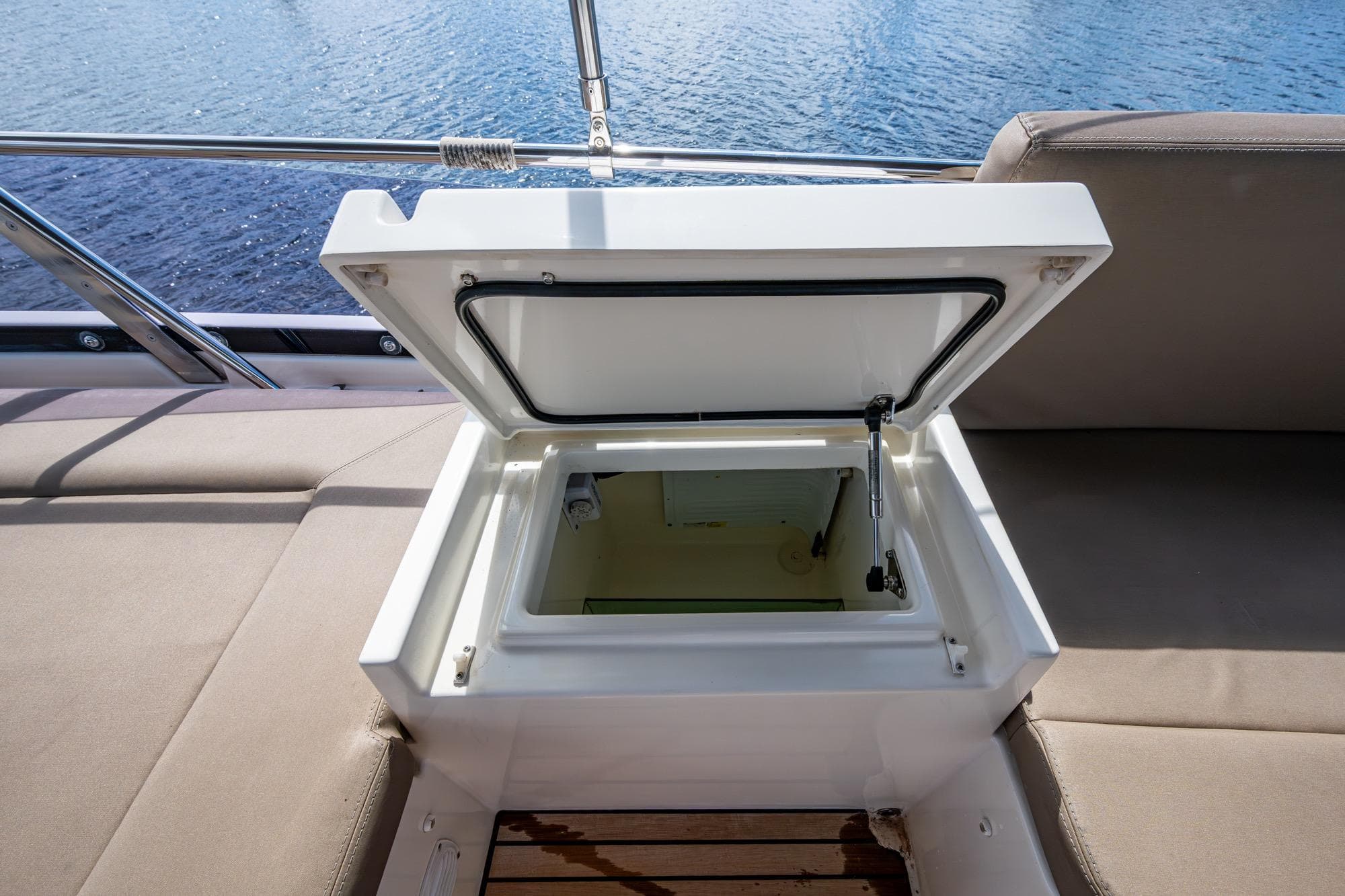Open storage compartment on 2012 Prestige Flybridge yacht, overlooking water.