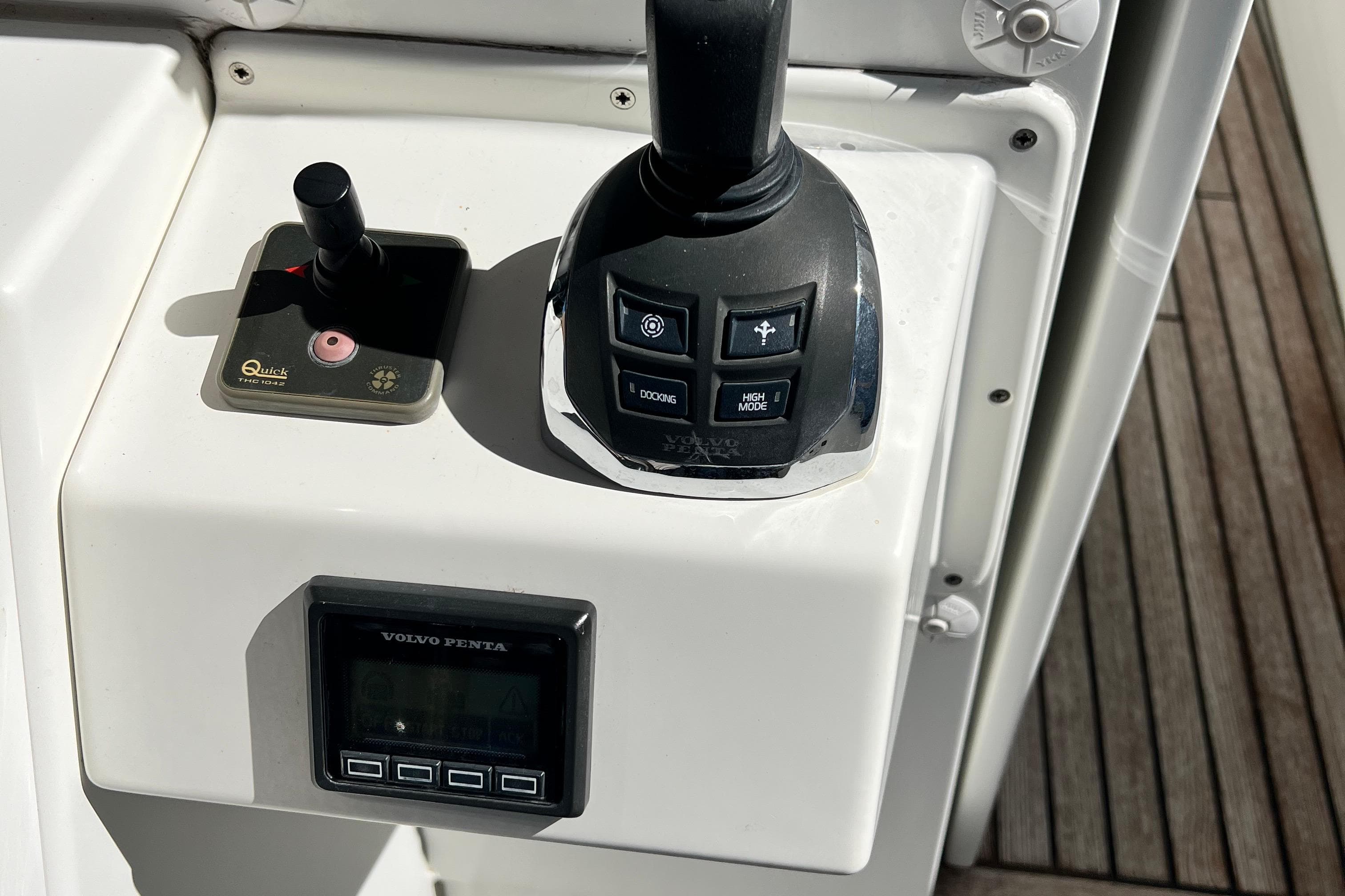 Control panel of a 2014 Beneteau Swift Trawler 50 with joystick and Volvo Penta display.