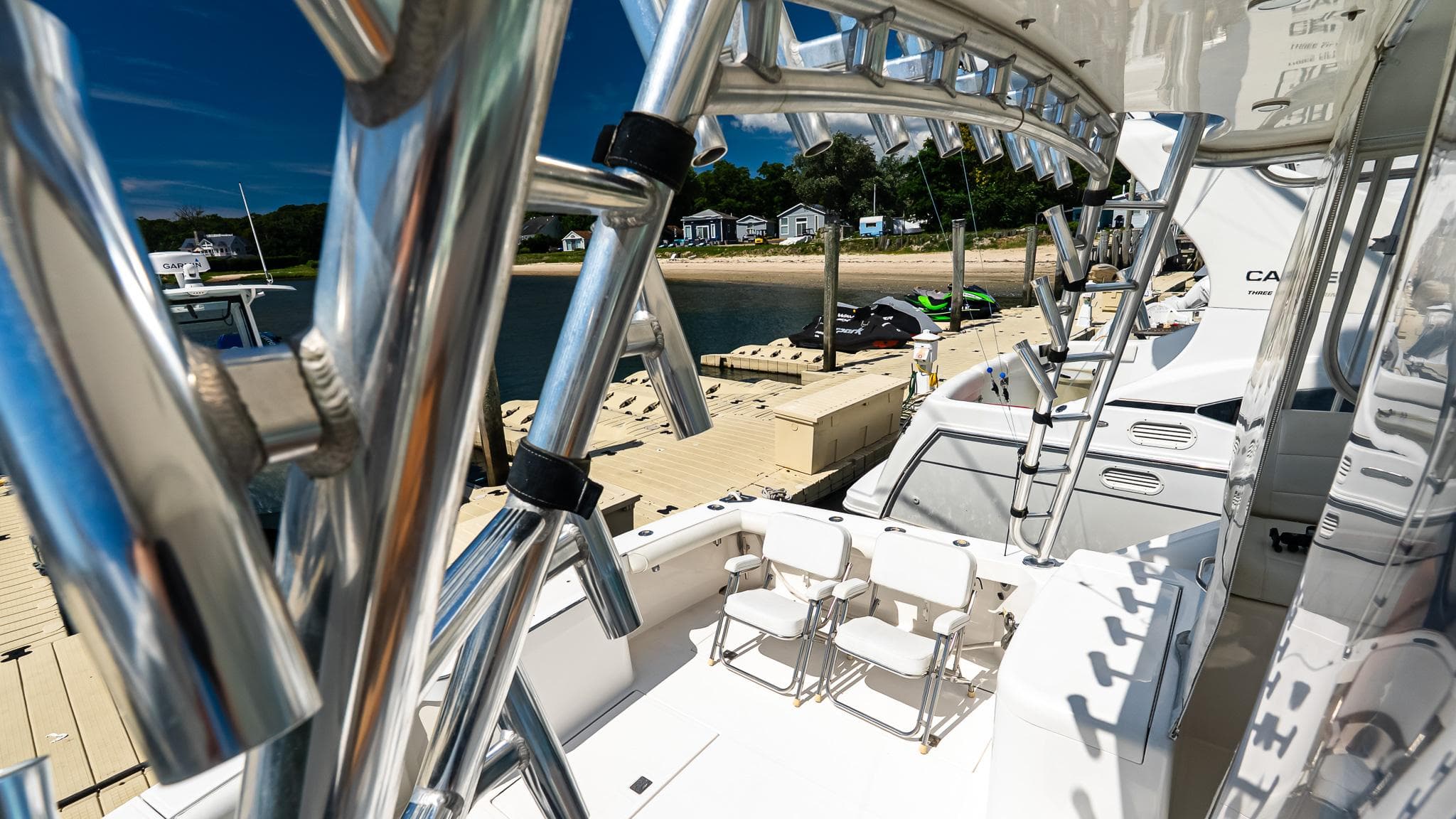 2008 Cabo 38 Express yacht docked, featuring sleek design and polished metalwork.