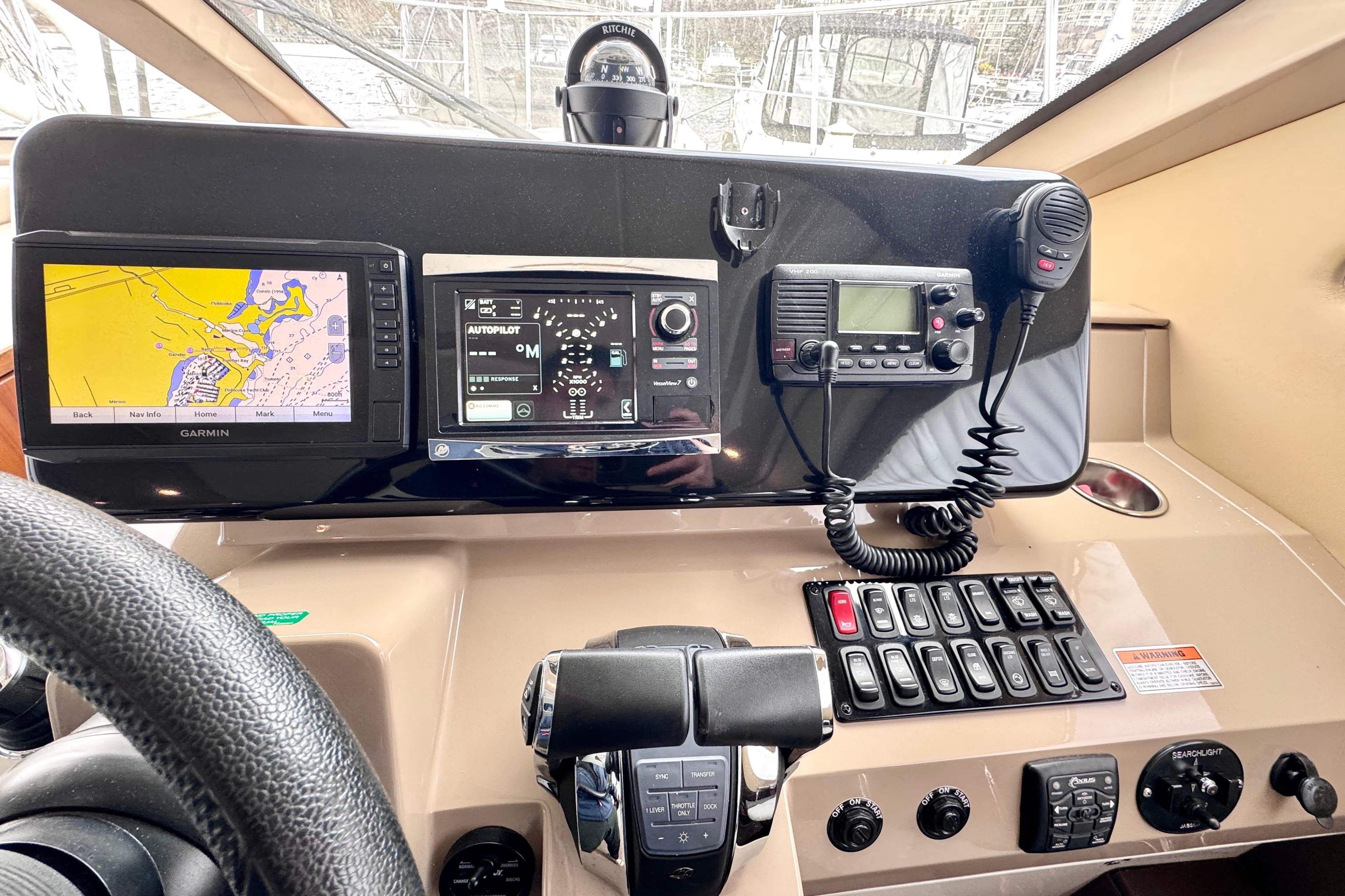 Control panel of a 2015 Carver C37 yacht with navigation and communication equipment.