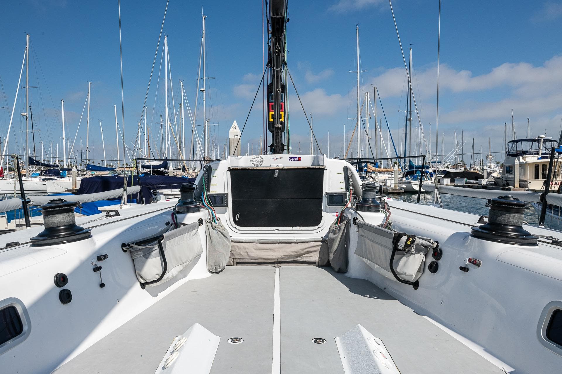 Cockpit view of 2009 Reichel Pugh 51 sailboat docked in a marina.