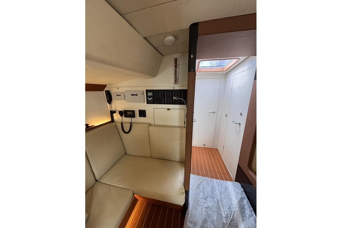 Interior of 2016 Nautor Swan ClubSwan 50 yacht with seating and navigation equipment.