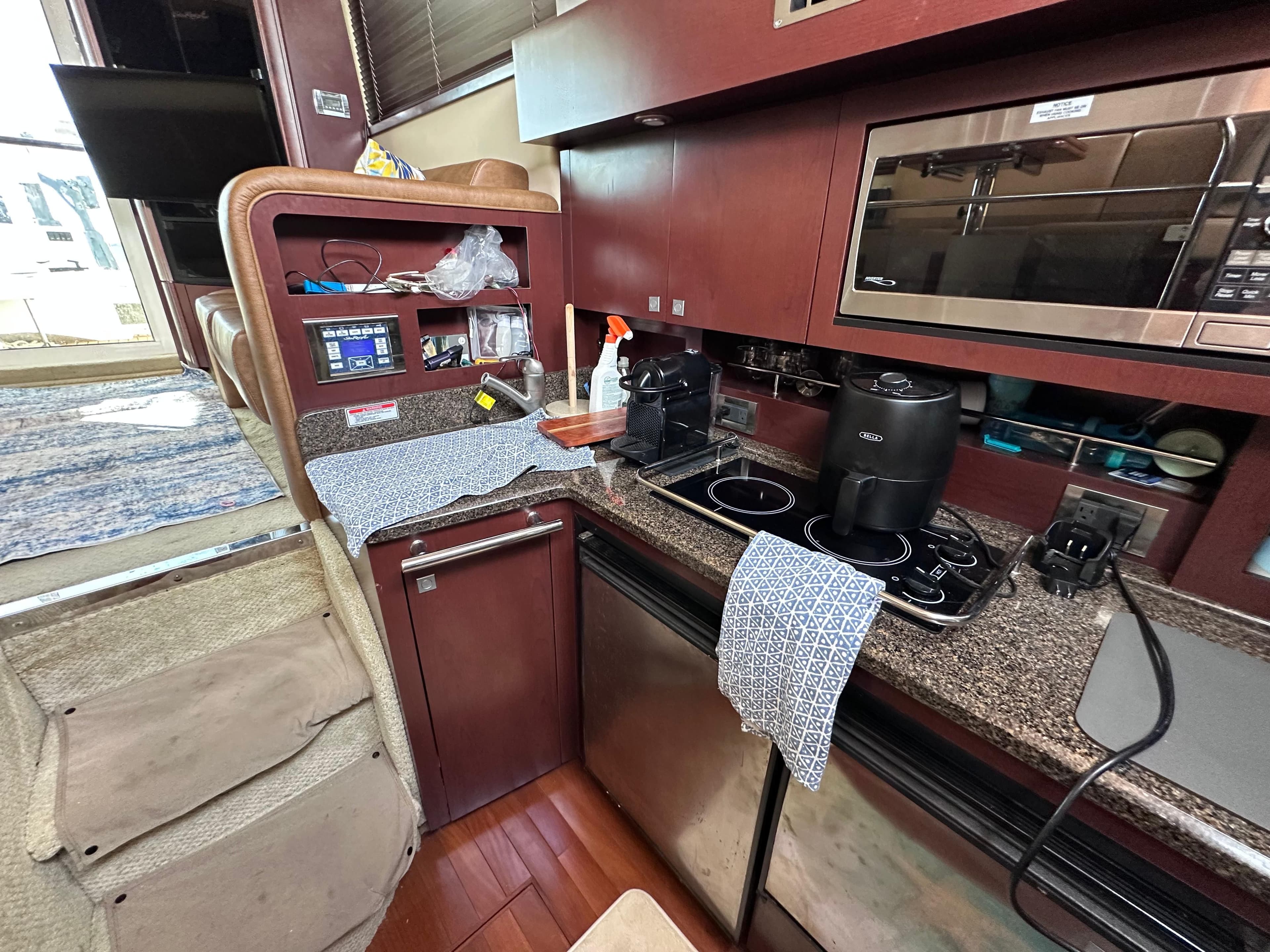 Interior of 2007 Sea Ray 36 Sedan Bridge with modern kitchen.