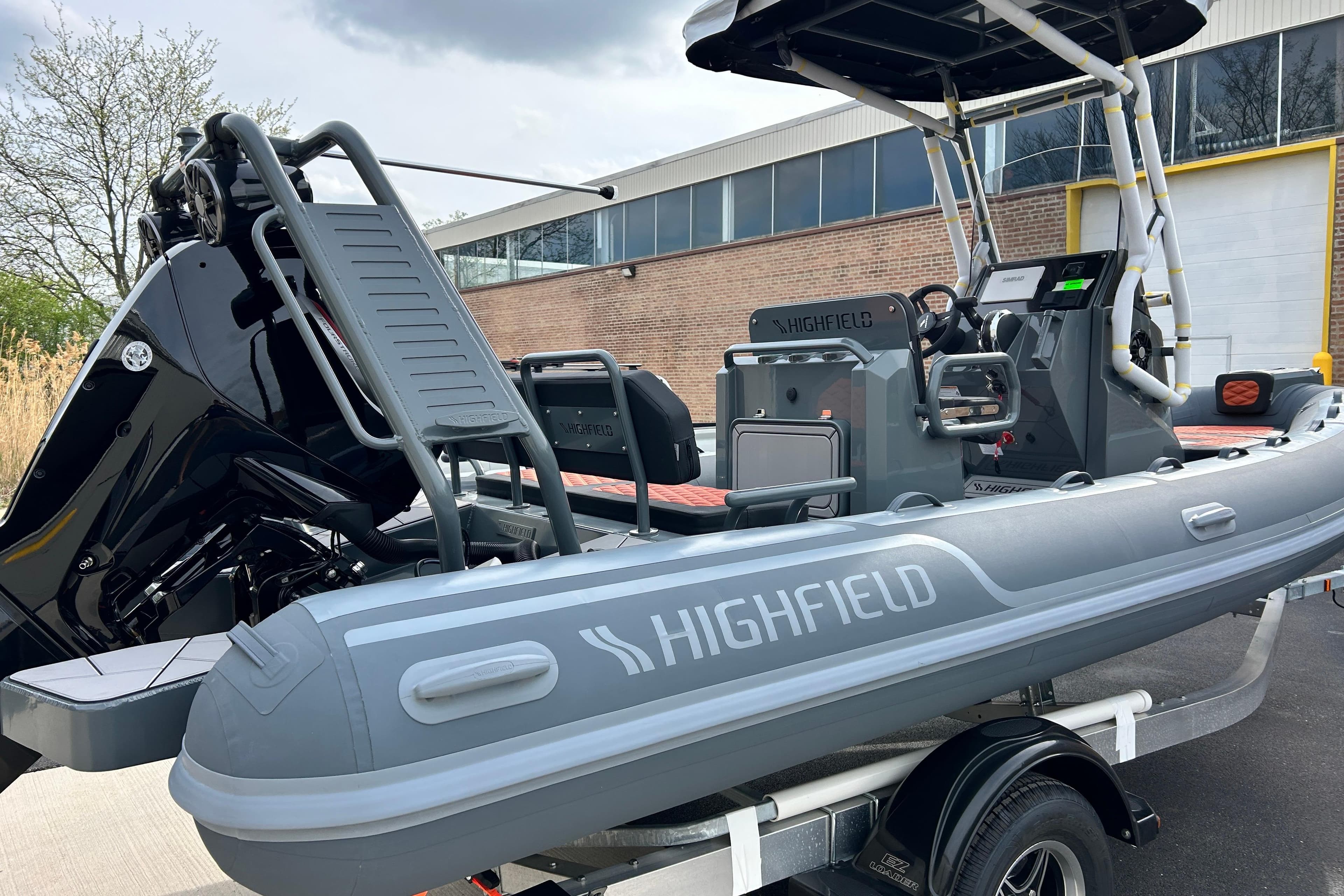 2026 Highfield Sport 560 inflatable boat on trailer, featuring sleek design and modern equipment.