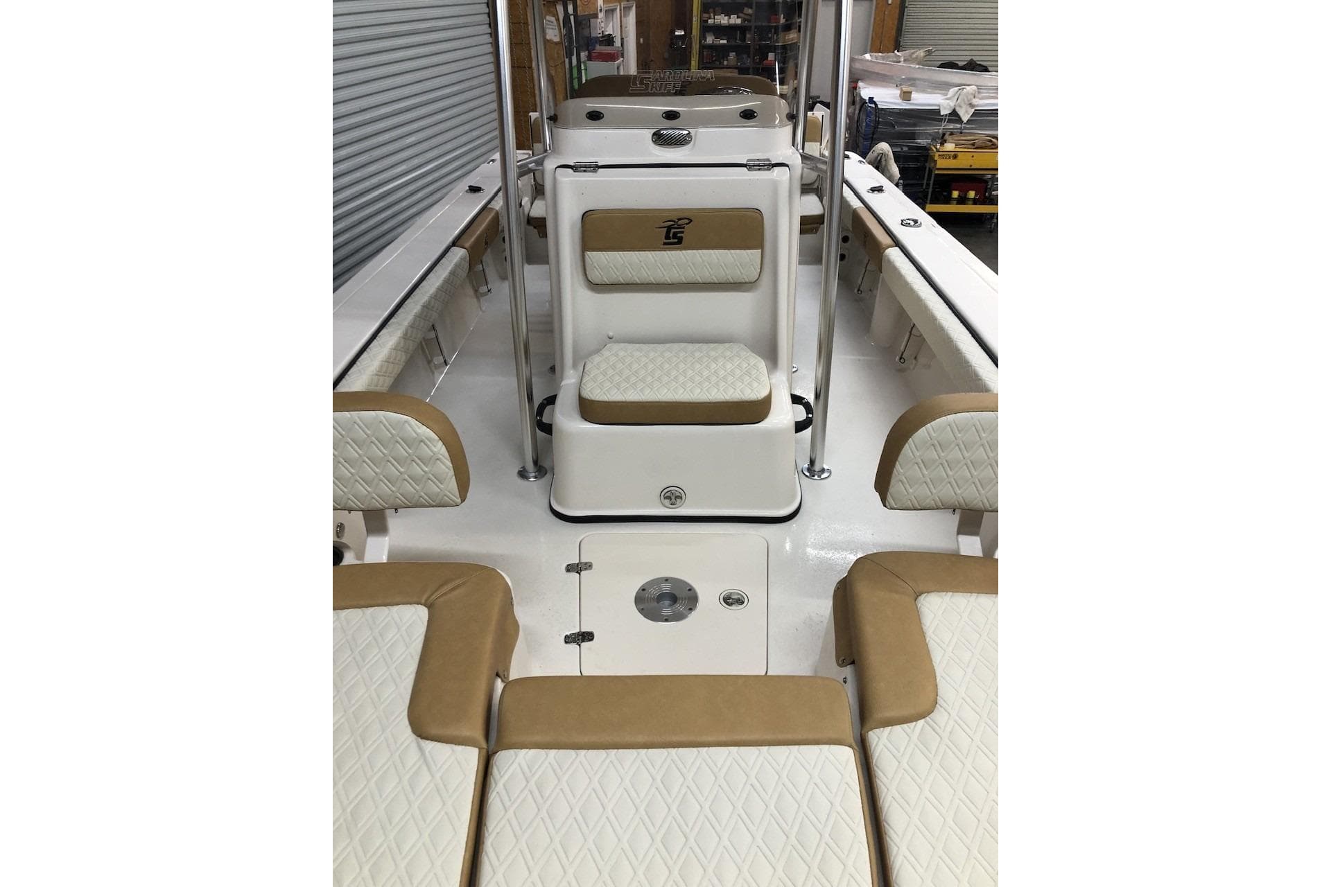 2025 Carolina Skiff 22 Ultra Elite boat interior with tan and white seating.