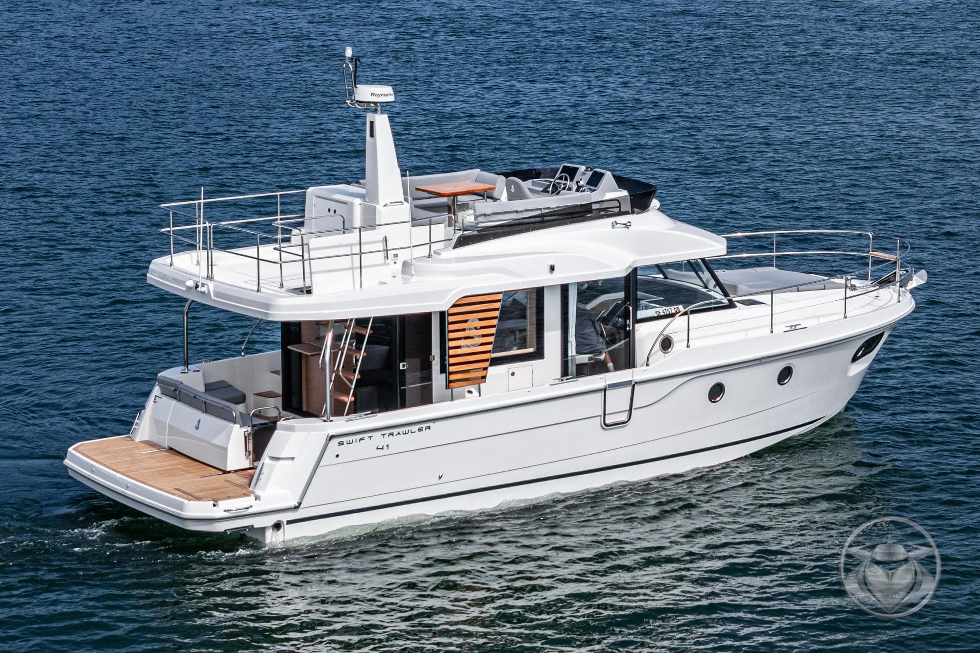 2026 Beneteau Swift Trawler 41 Fly cruising on open water.