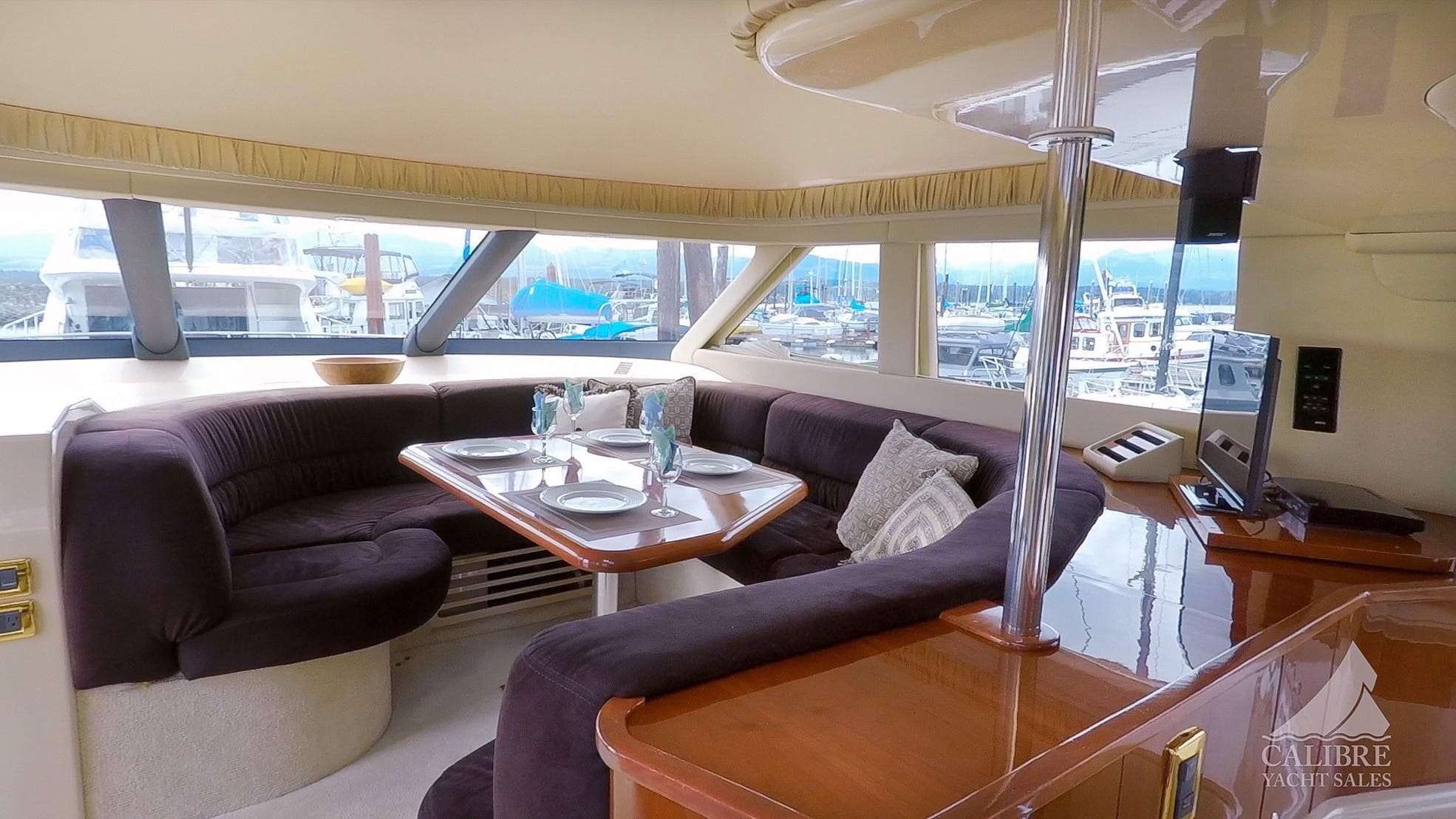 Luxurious interior of 2002 Sea Ray 540 Cockpit Motor Yacht with elegant dining area.