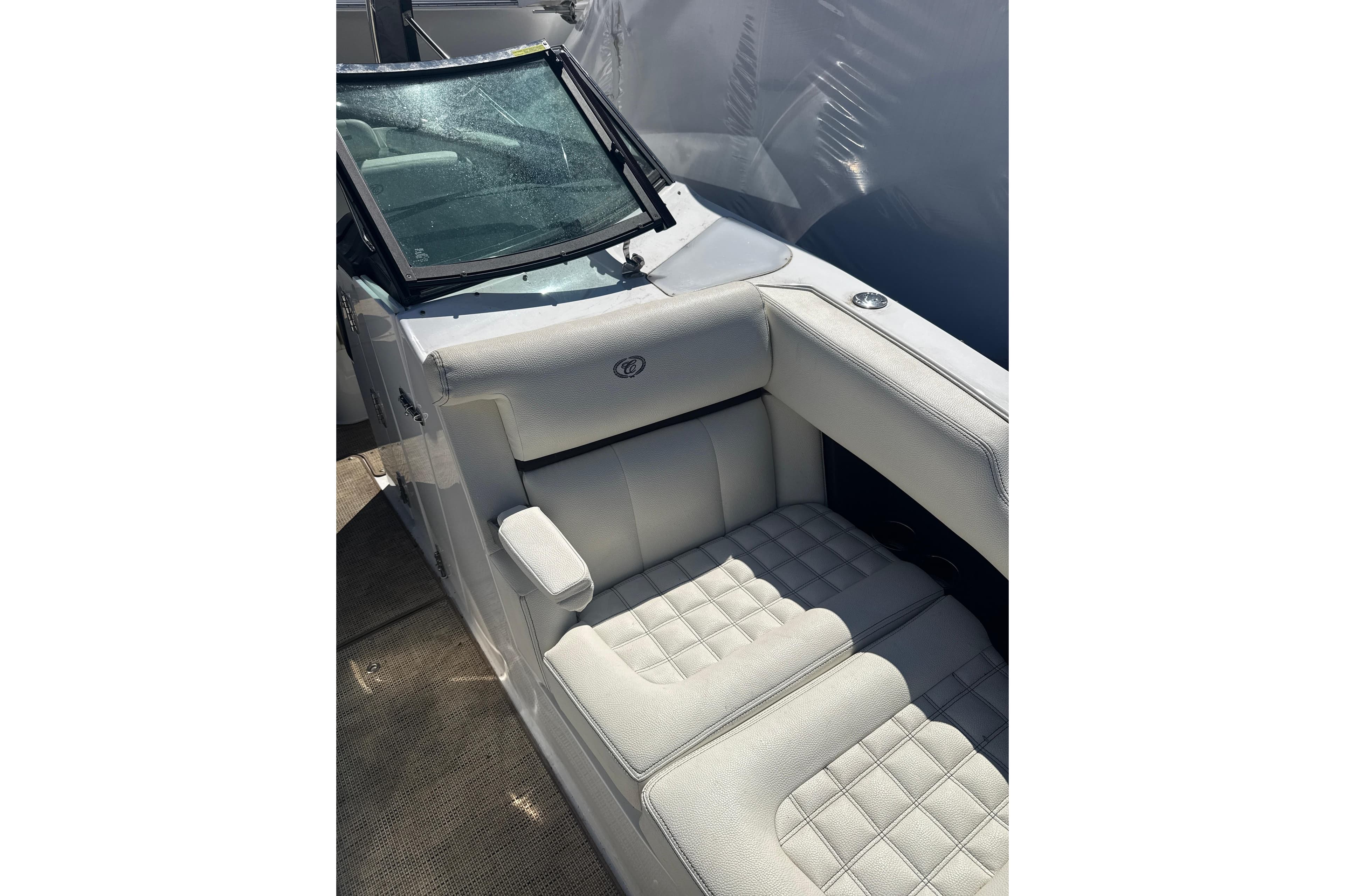 2020 Cobalt R30 boat interior with white cushioned seating and windshield.