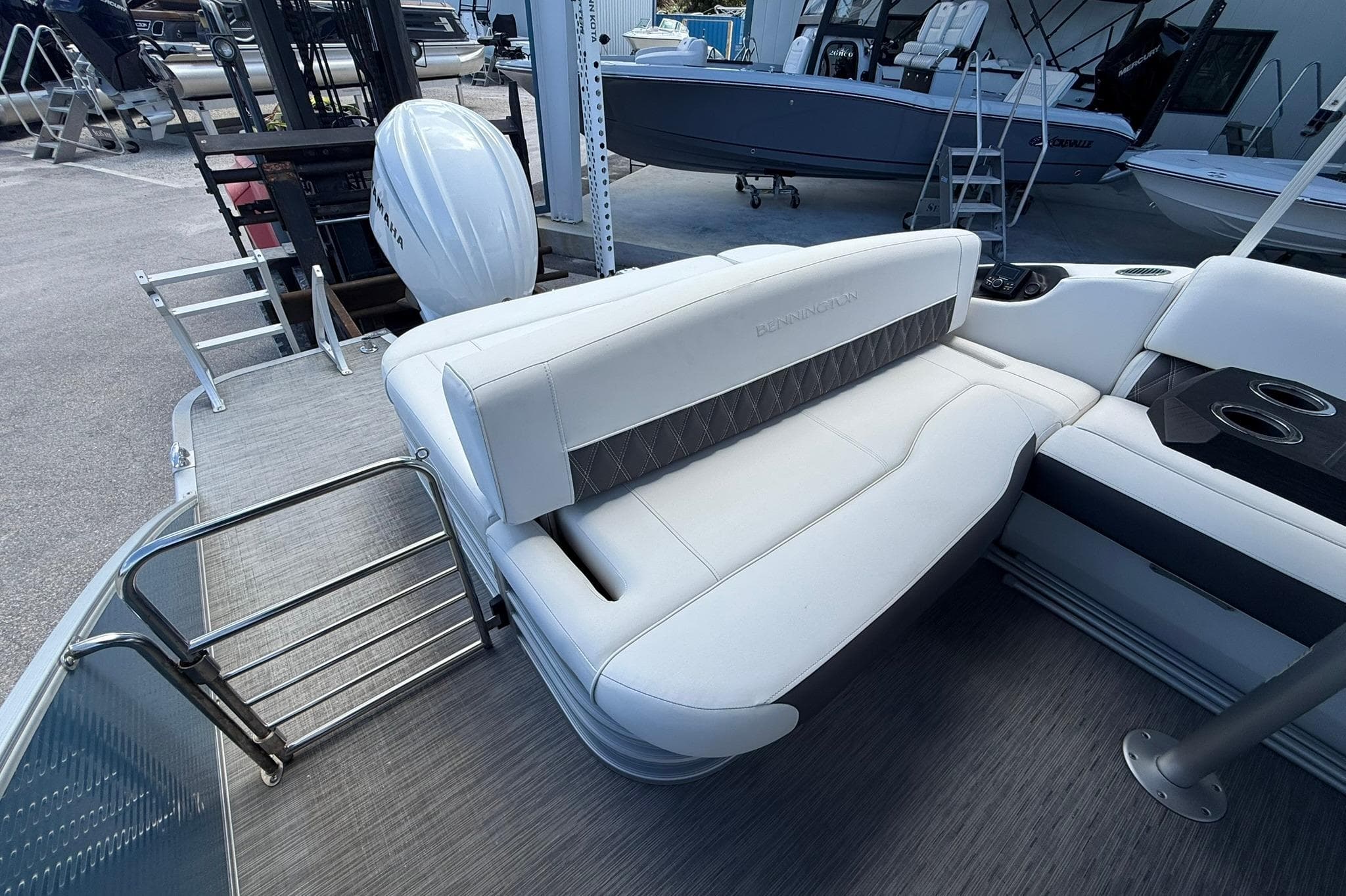 2022 Bennington LX 26 Swingback boat interior with white seating and stainless steel ladder.