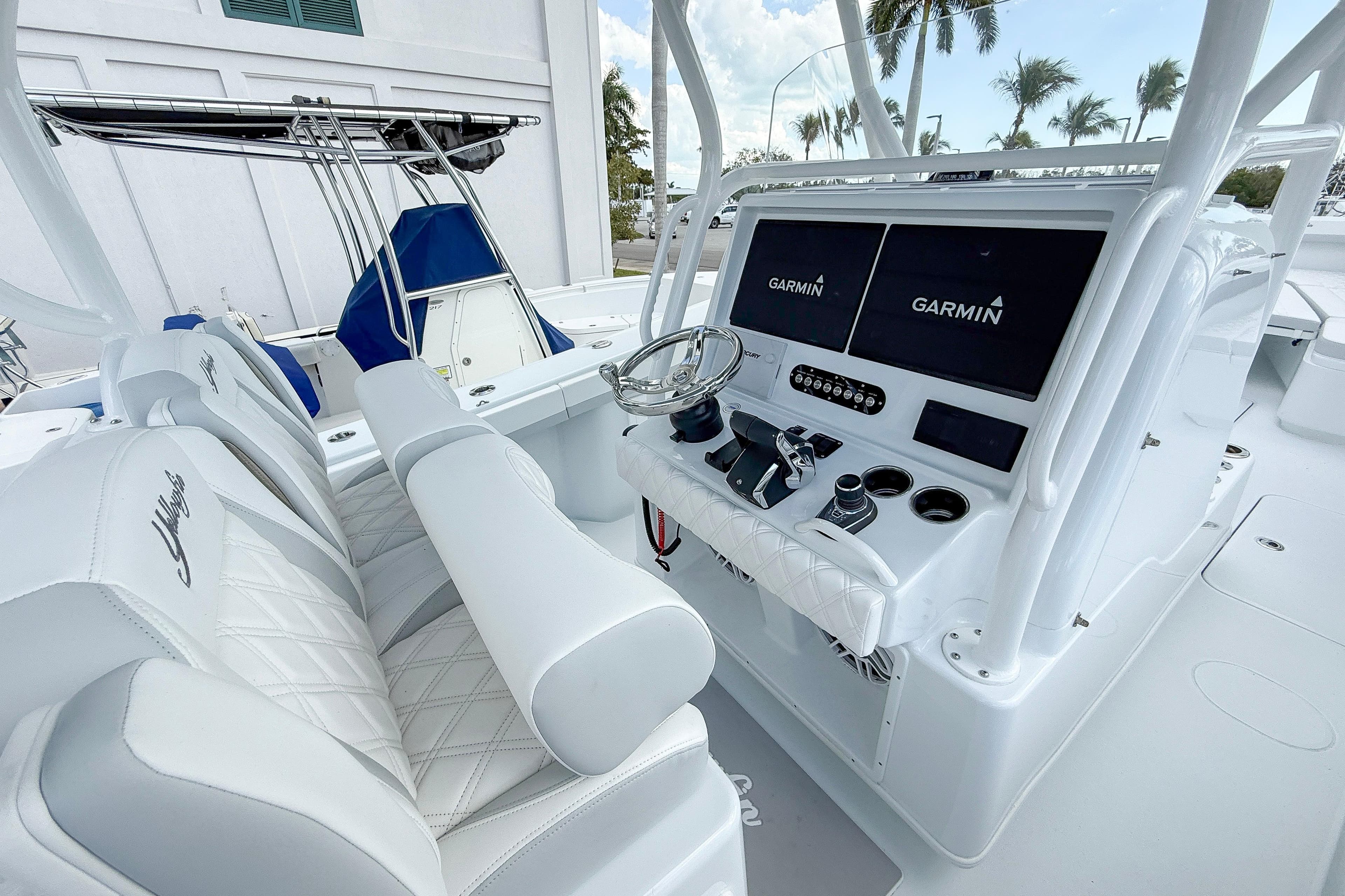 2024 Yellowfin 34 Offshore boat cockpit with Garmin displays and luxurious seating.