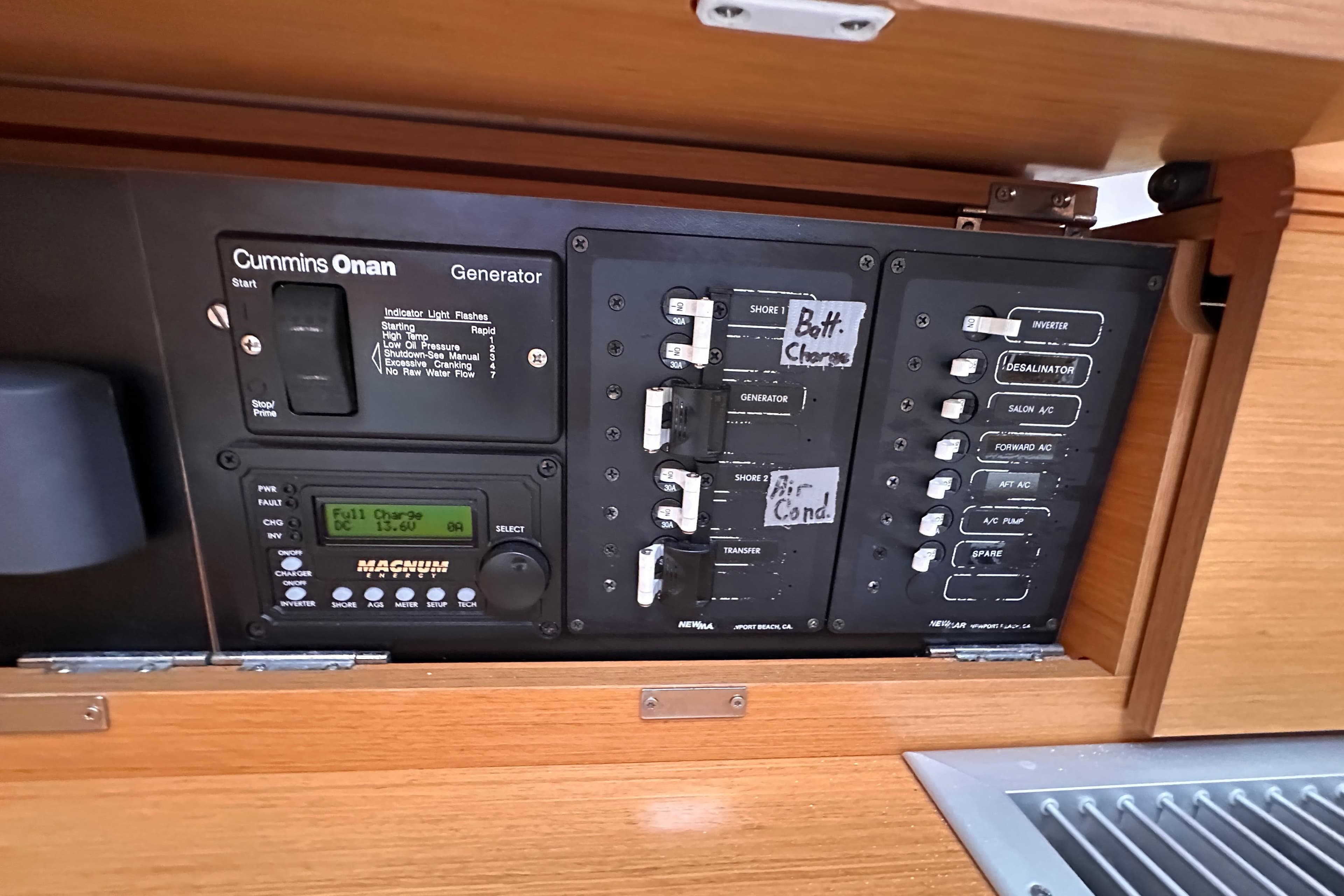 Electrical panel of 2015 Jeanneau Sun Odyssey 469 sailboat with Cummins Onan generator controls.
