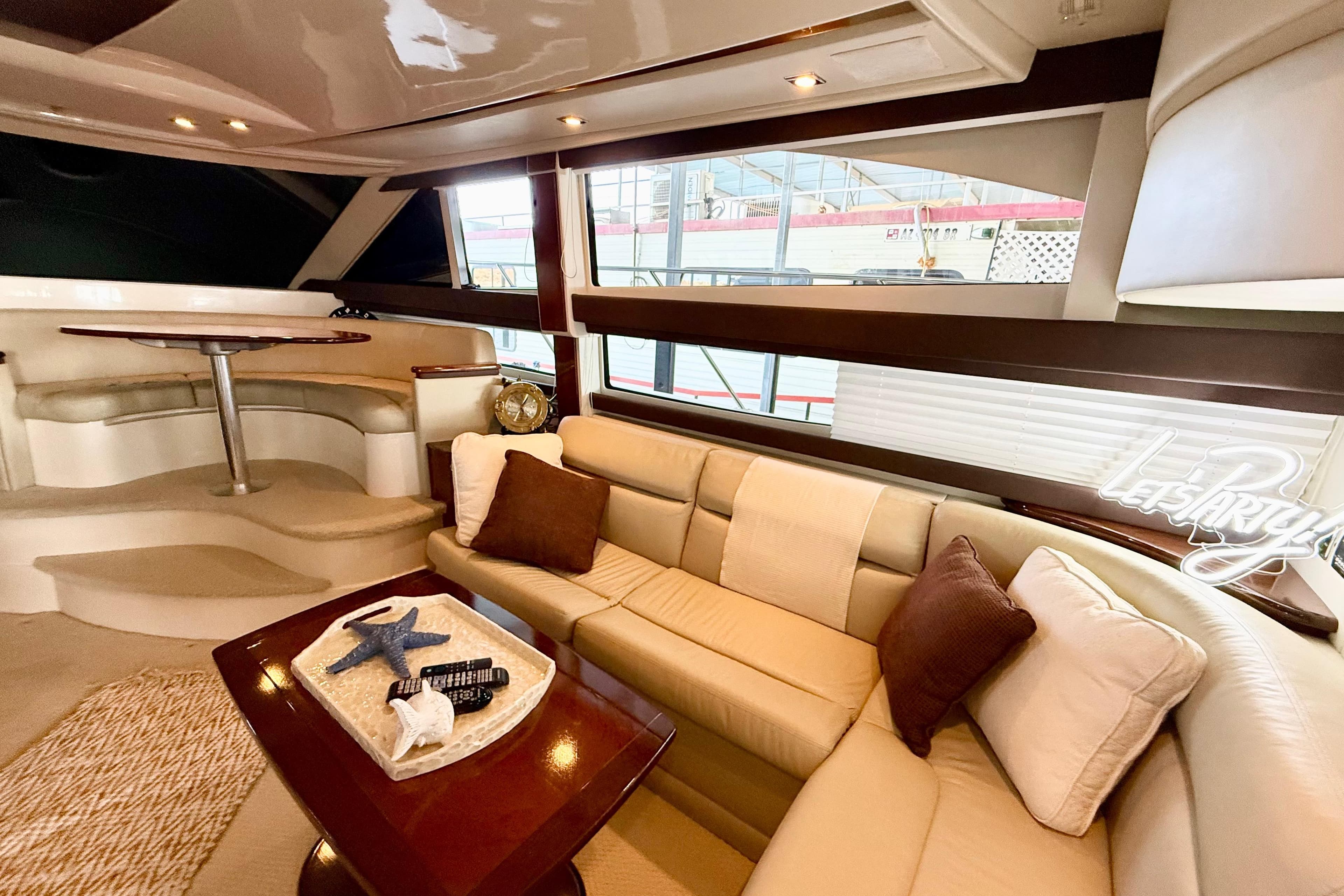 Luxurious interior of 2011 Meridian 391 Sedan yacht with plush seating and elegant decor.
