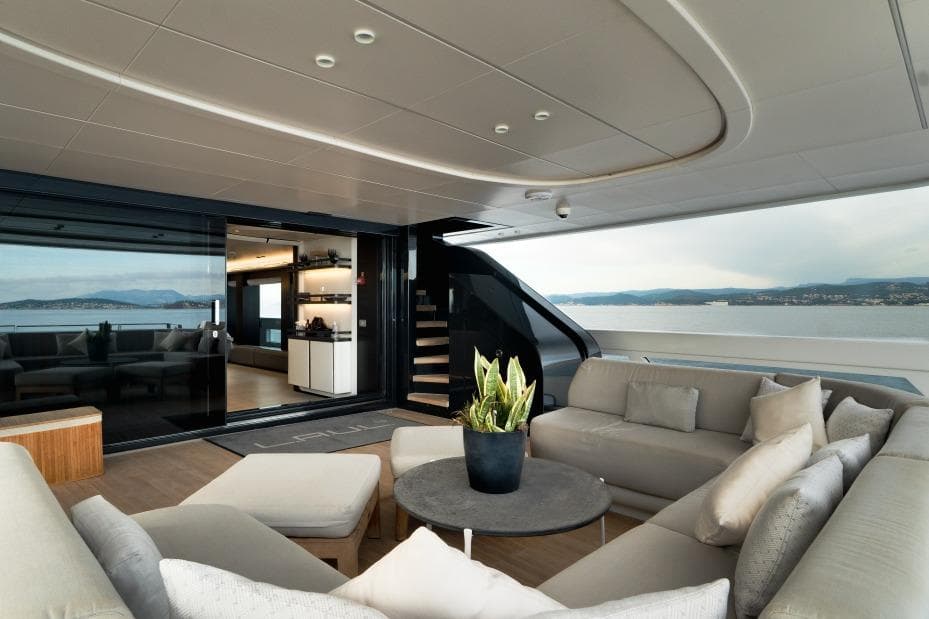 Luxurious 2019 ISA Extra 130 yacht interior with elegant seating and ocean view.