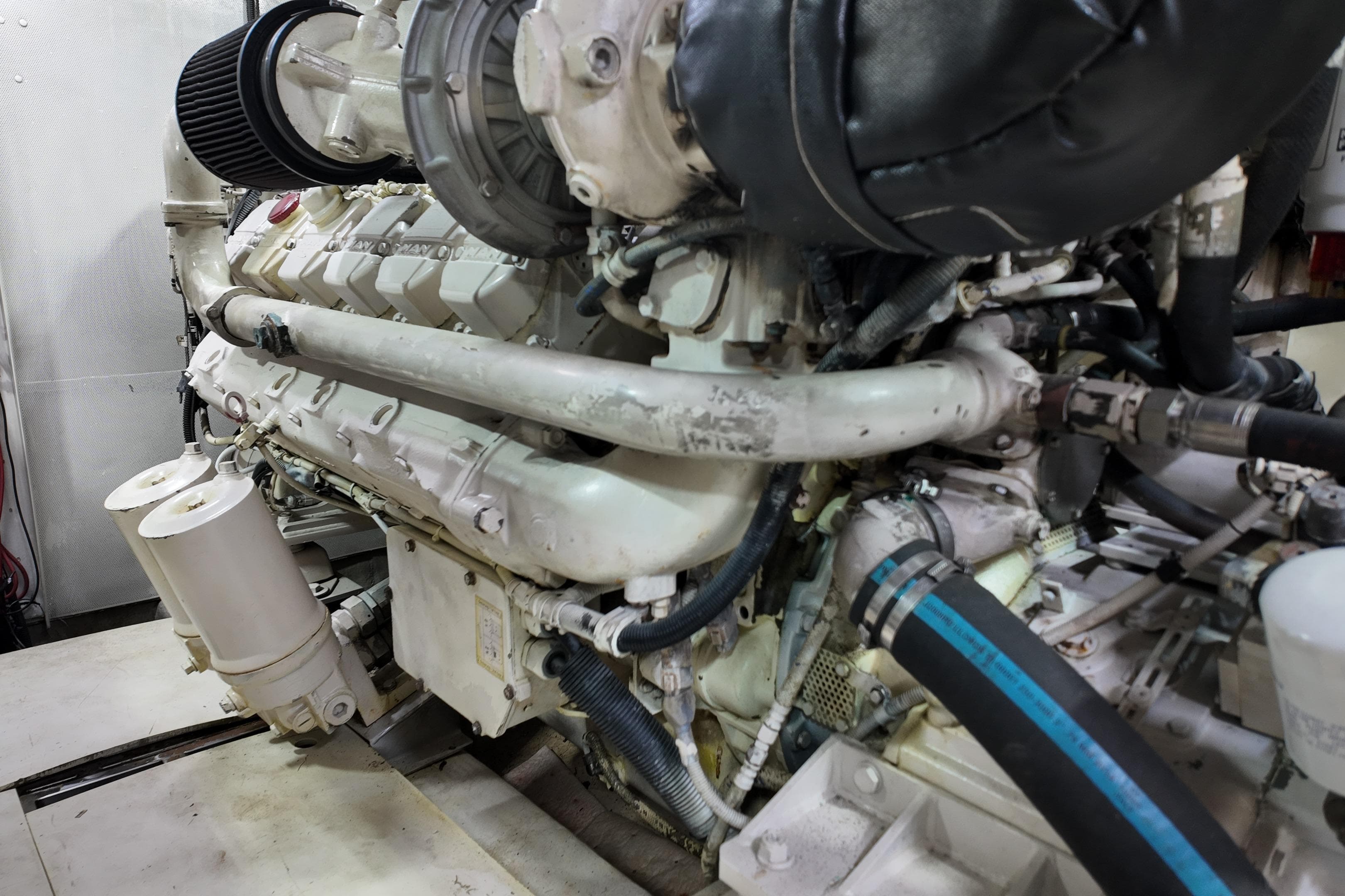 Engine of a 2006 Azimut 68E yacht, showcasing intricate mechanical components.