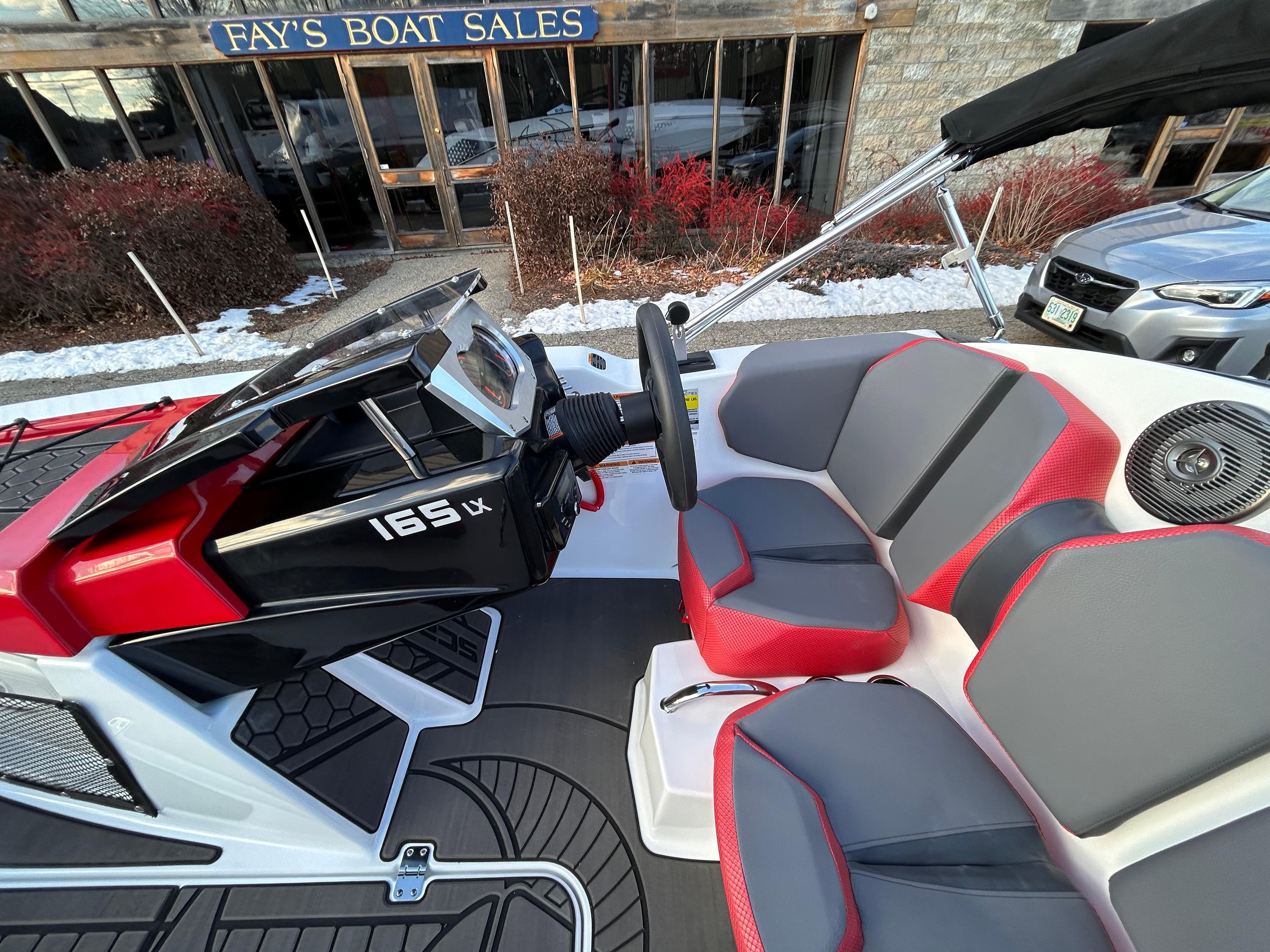 2025 Scarab 165 LX boat interior with red and gray seating at Fay's Boat Sales.