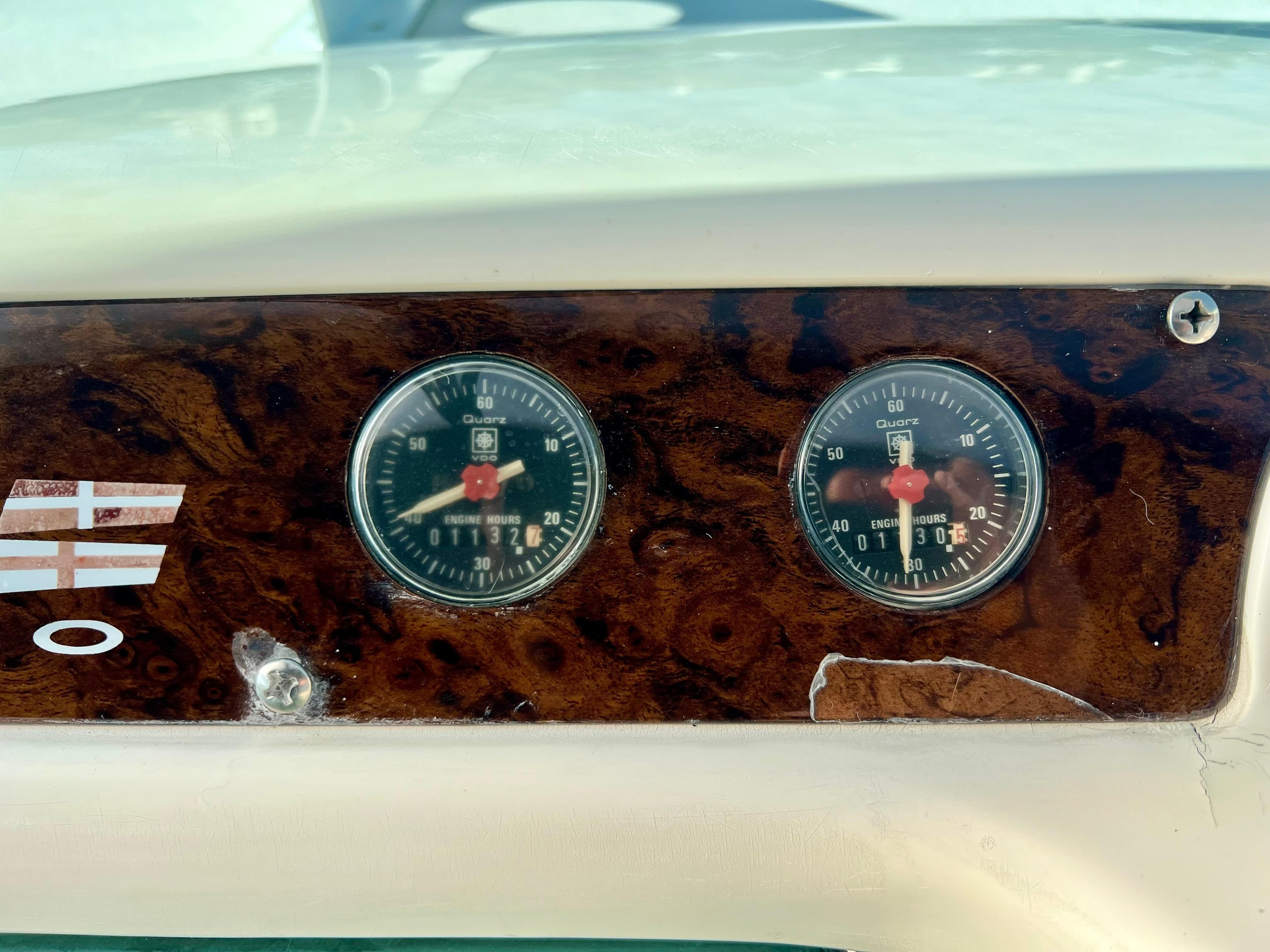 Dashboard of 1999 Fairline Targa 48 Open with engine hour meters.