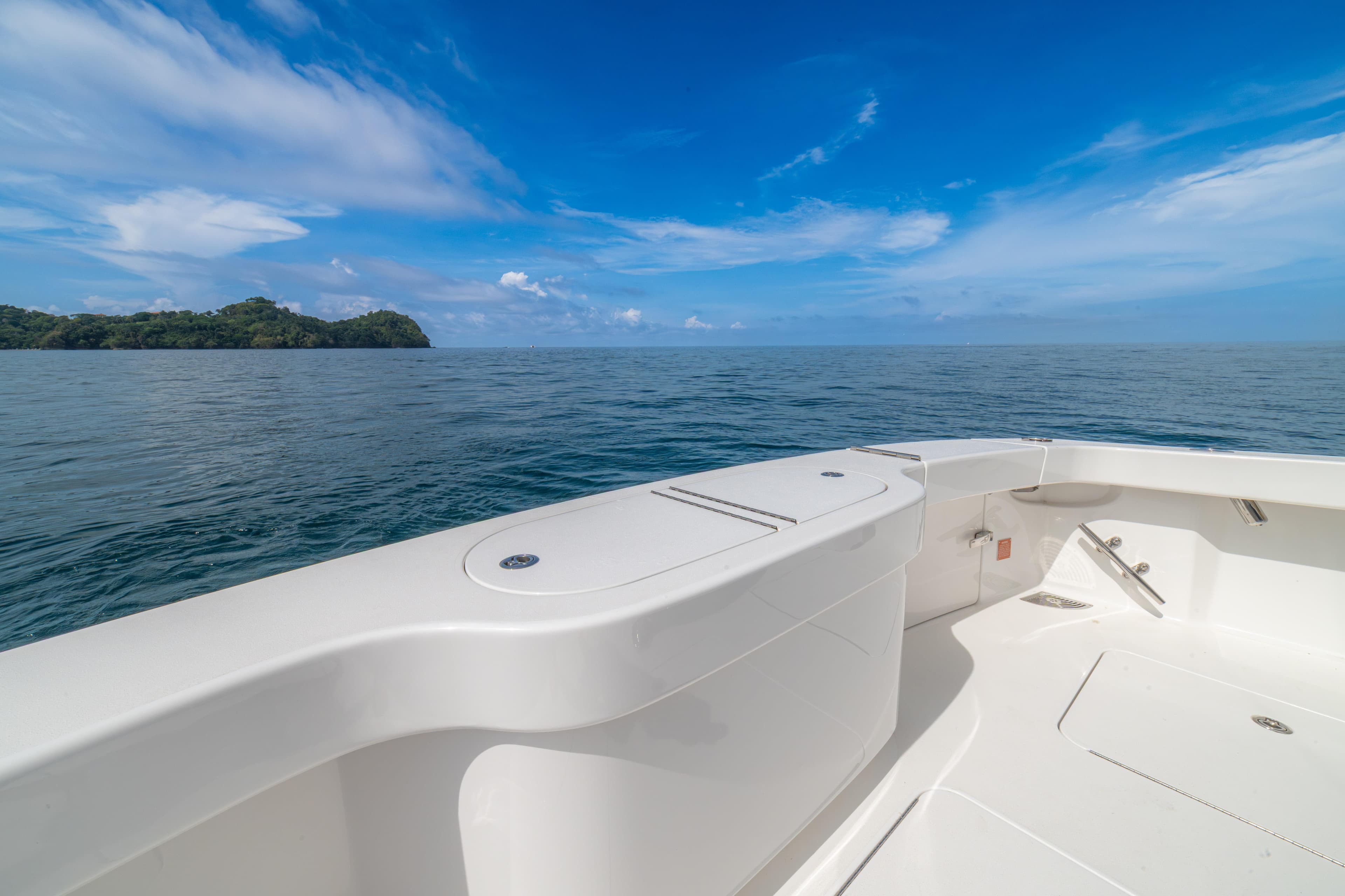 2024 Viking 48 Convertible yacht deck with ocean view and blue sky.