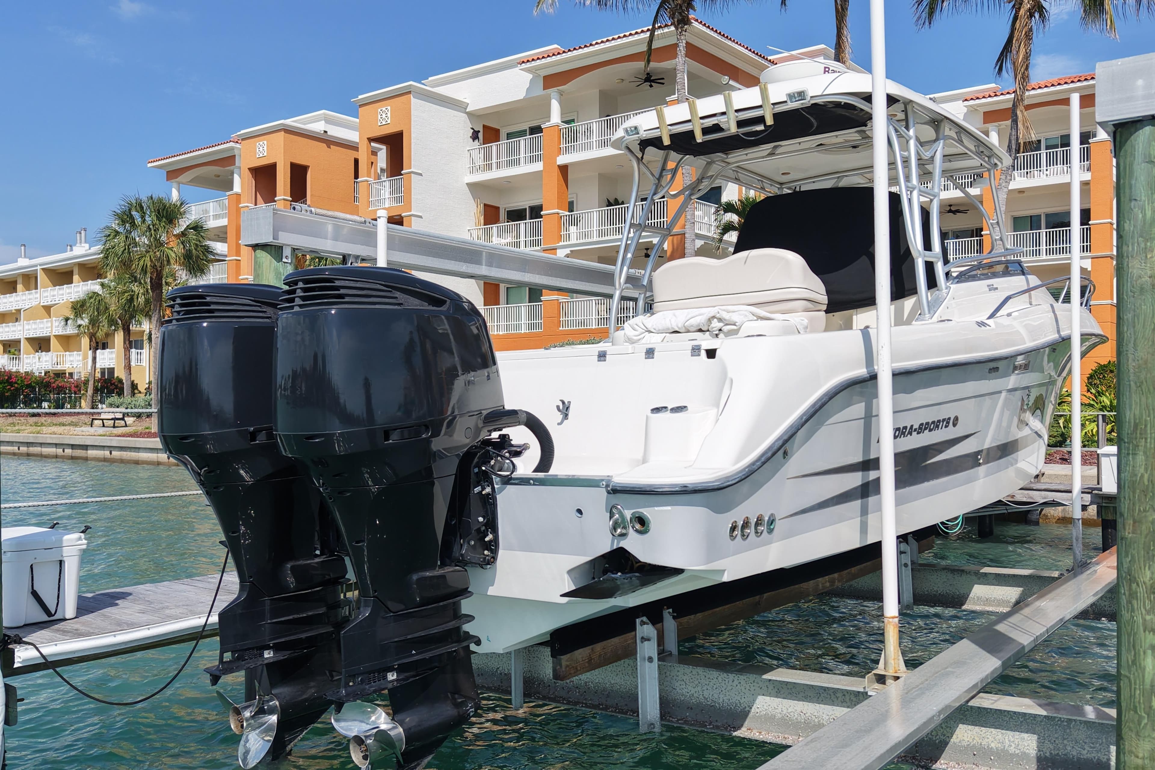 2005 Hydra-Sports Vector 3300 VX boat docked near waterfront buildings.