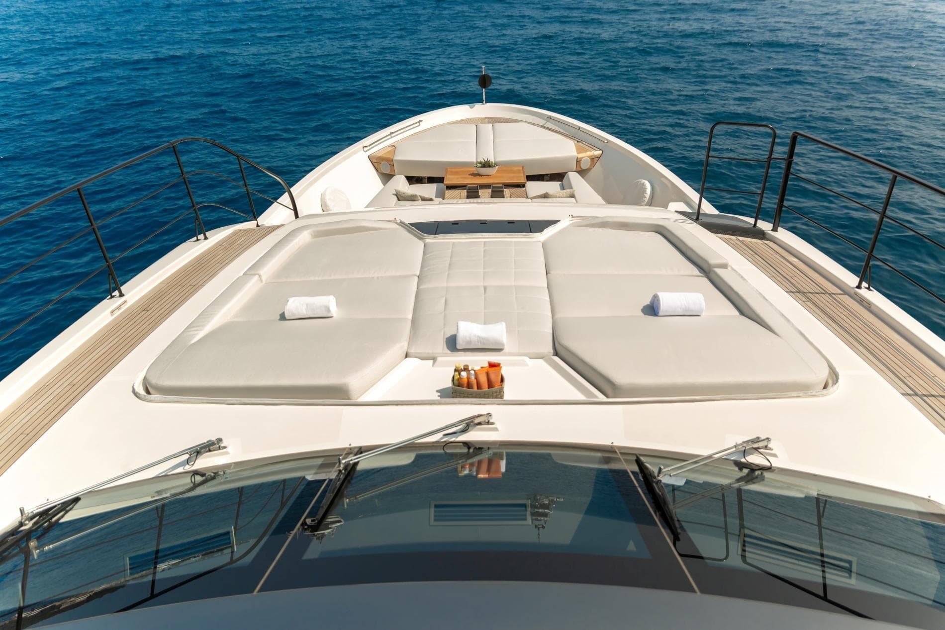 Luxurious 2024 Sanlorenzo SL 106 Asymmetric yacht deck with sun loungers and ocean view.