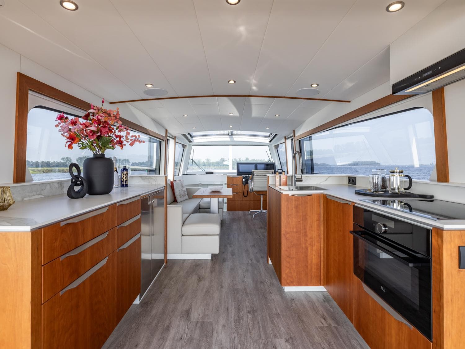 Interior of Altena 54 Next Generation yacht, modern kitchen and lounge.