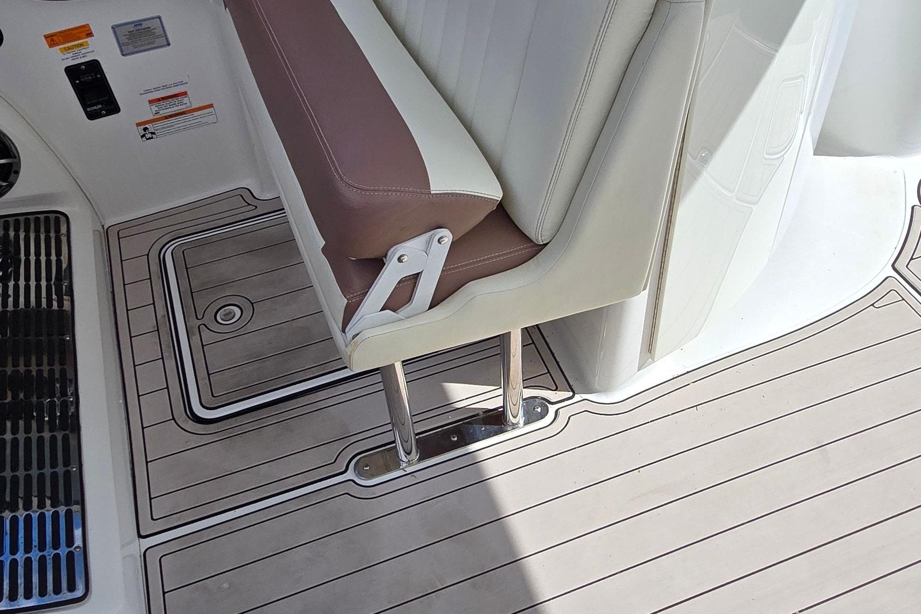 2011 Cobalt 323 boat interior with brown and white seating and teak-style flooring.