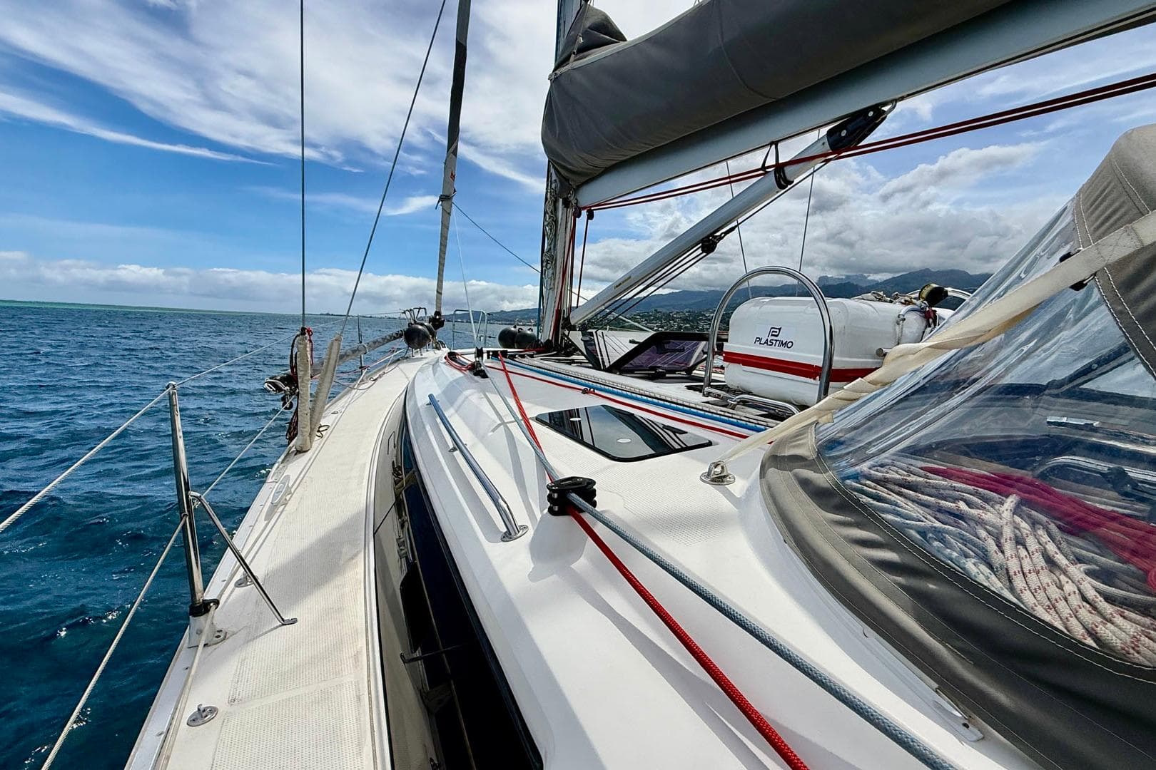 2017 Bavaria Cruiser 41S sailing on open sea under clear skies.