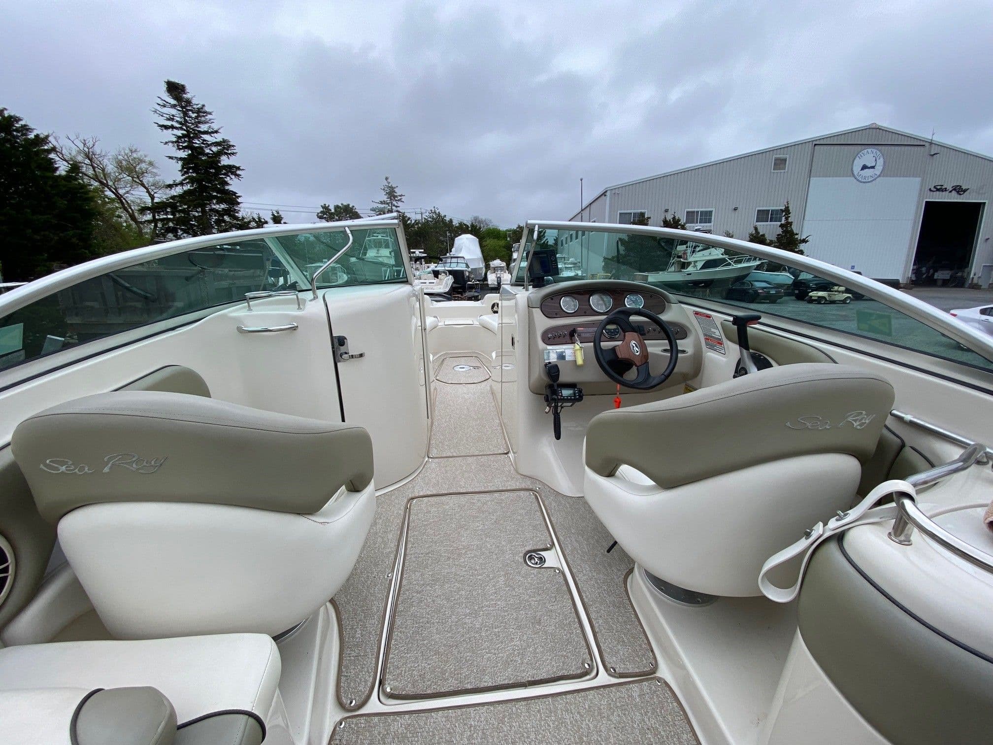 Interior of a 2006 Sea Ray 240 Sundeck boat with helm console.