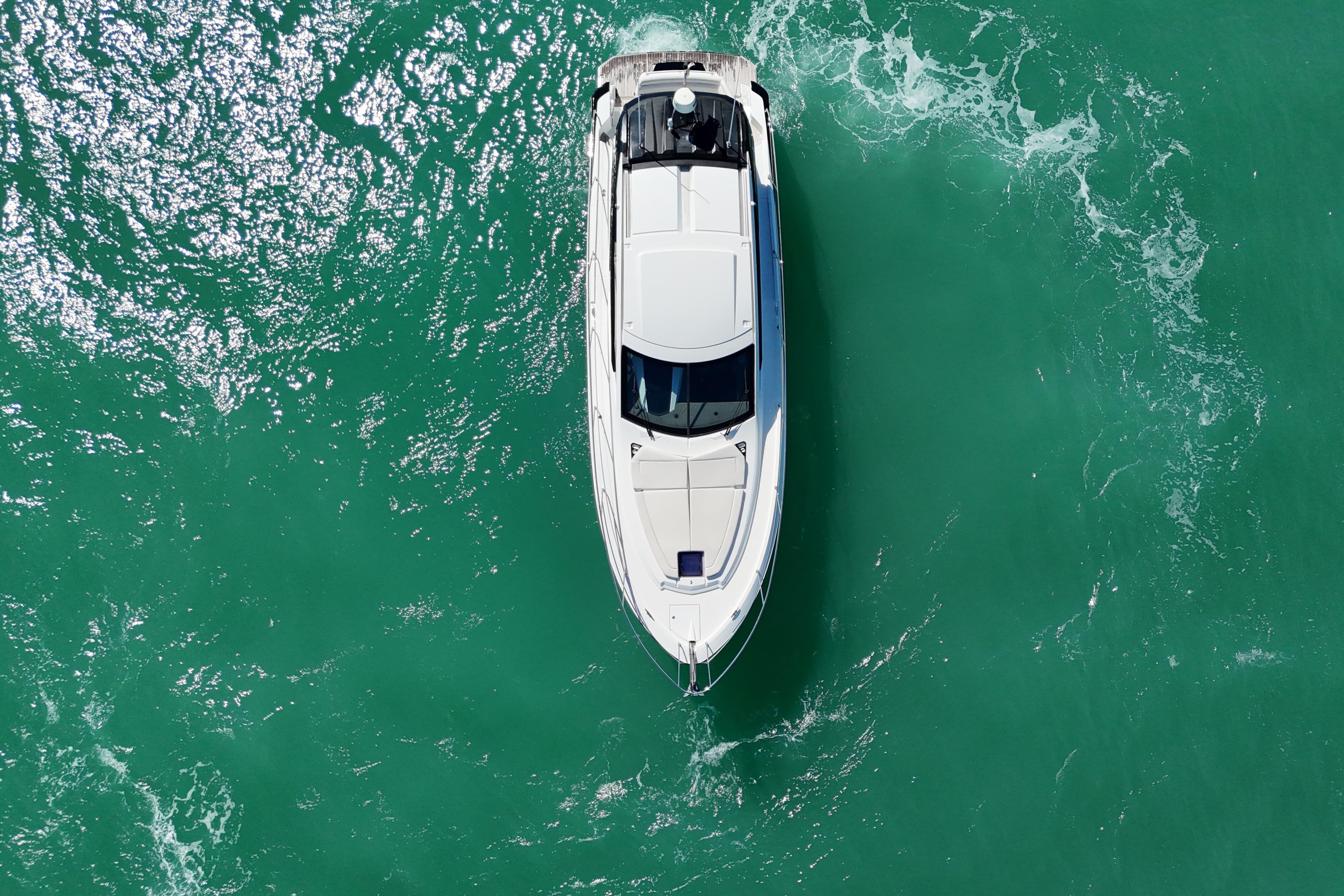 Aerial view of 2018 Beneteau Gran Turismo 50 yacht cruising in turquoise waters.