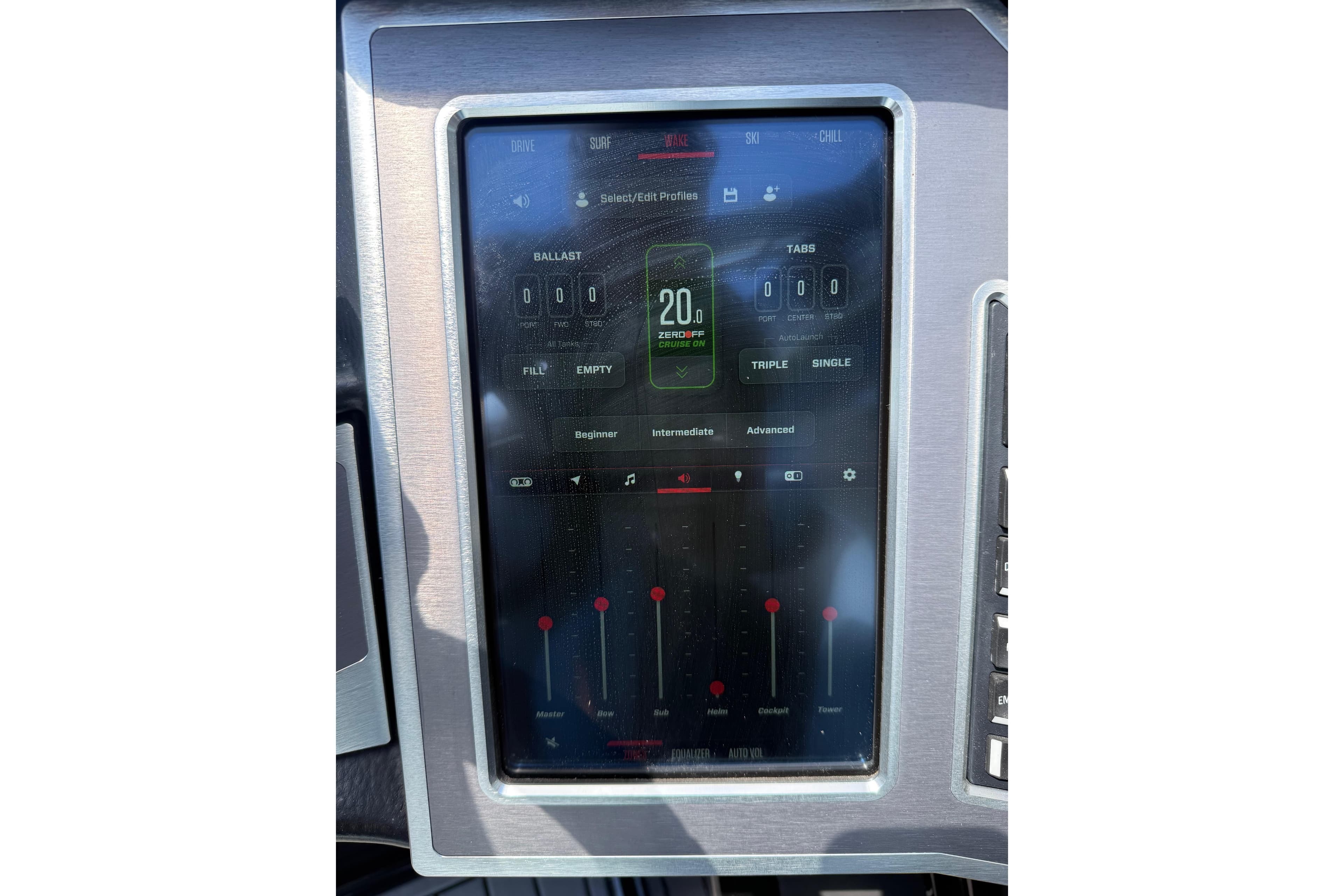 Touchscreen control panel of 2022 MasterCraft XT24 boat displaying ballast and tab settings.