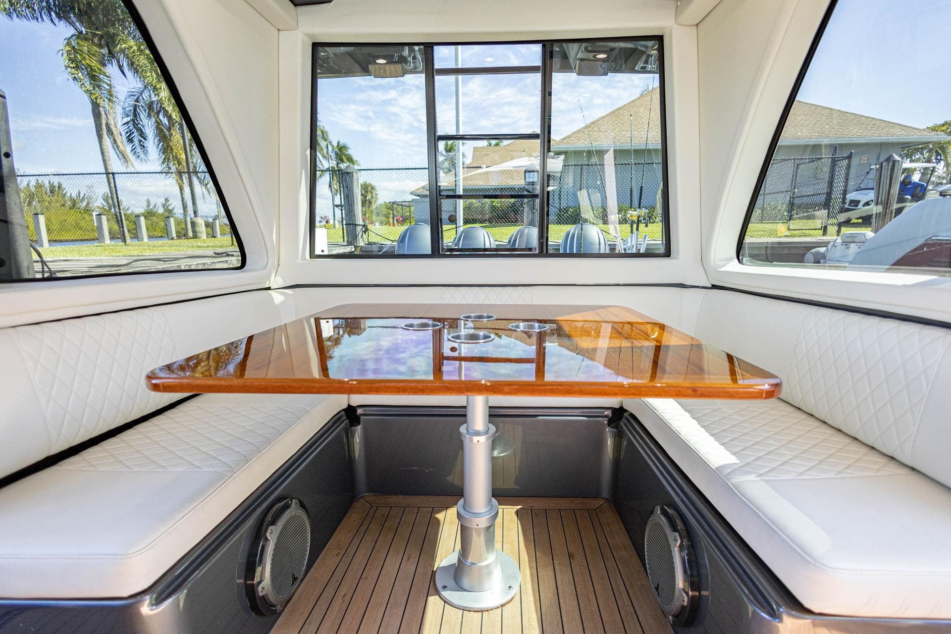 Luxurious interior of 2017 Gulf Crosser 52 yacht with elegant seating and wooden table.