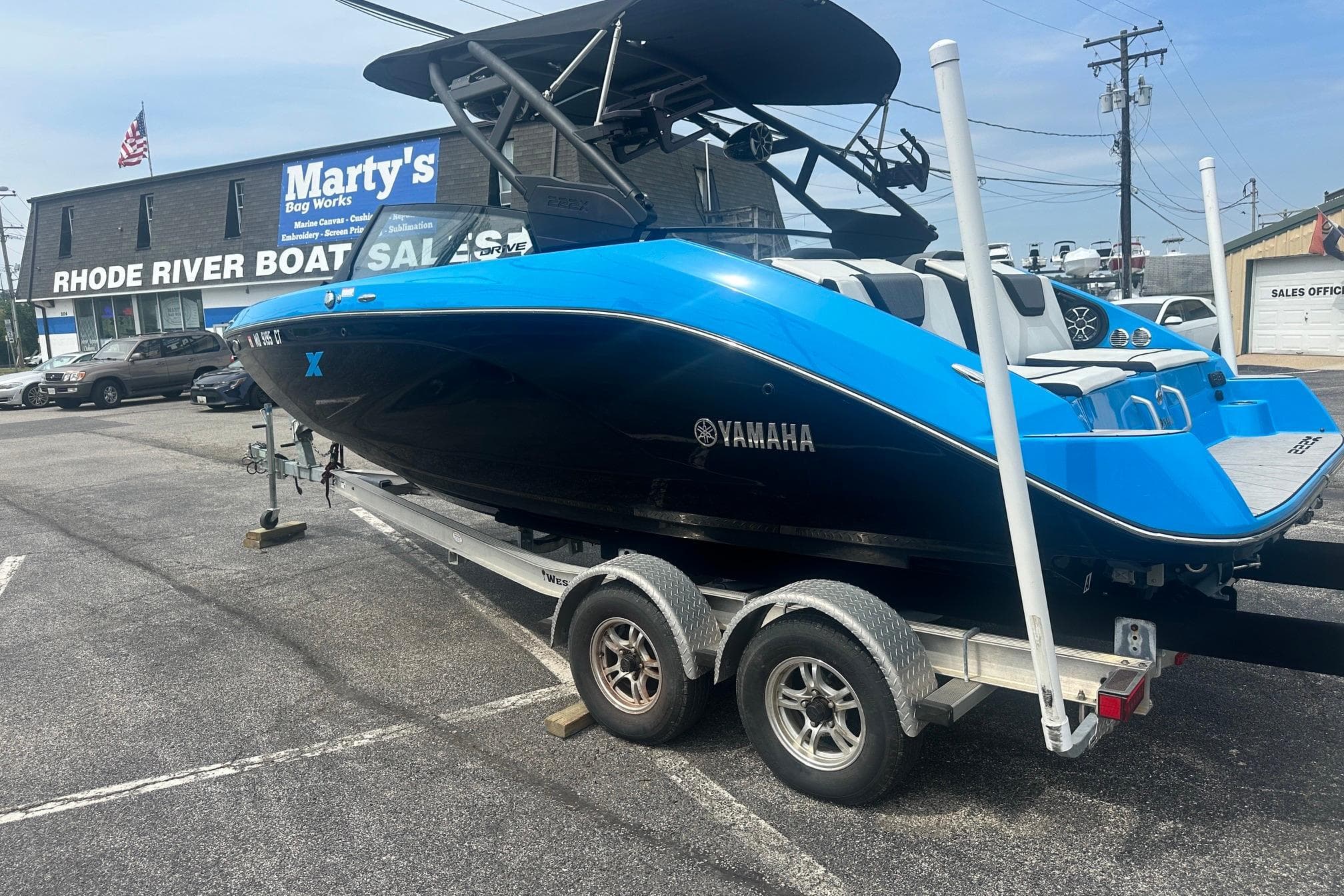 2023 Yamaha Boats 222XD in blue and black on a trailer at Rhode River Boat Sales.